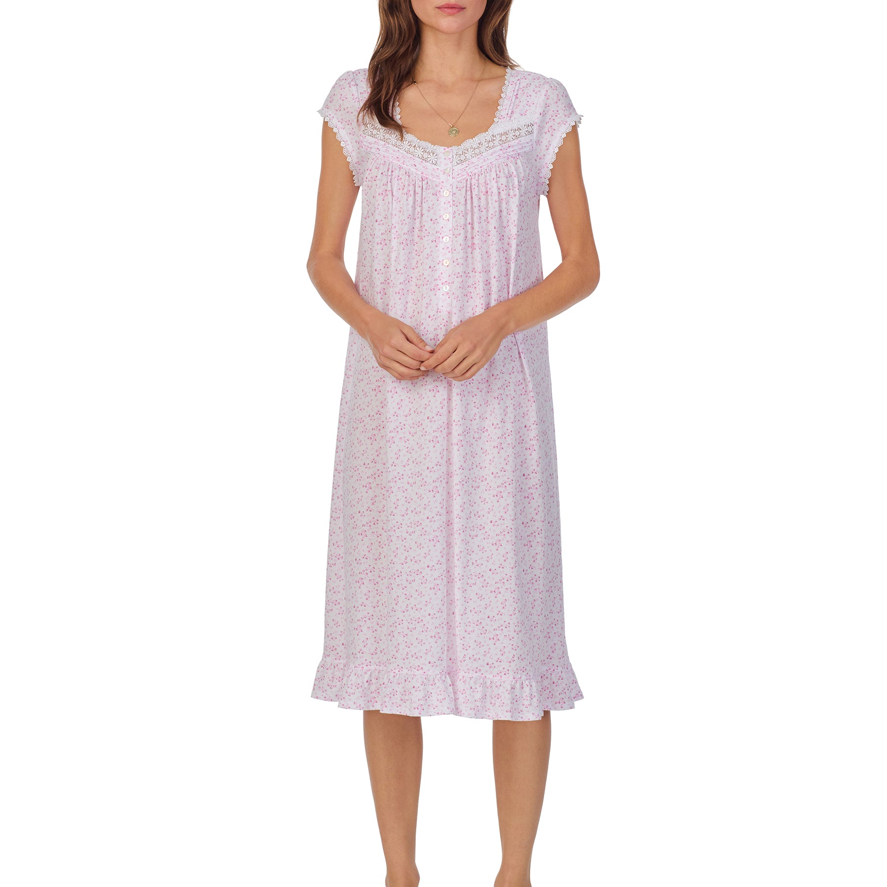 Front view of a women's floral nightshirt in a white pink ditsy print, showcasing intricate lace trim, button detailing, and cap sleeves.