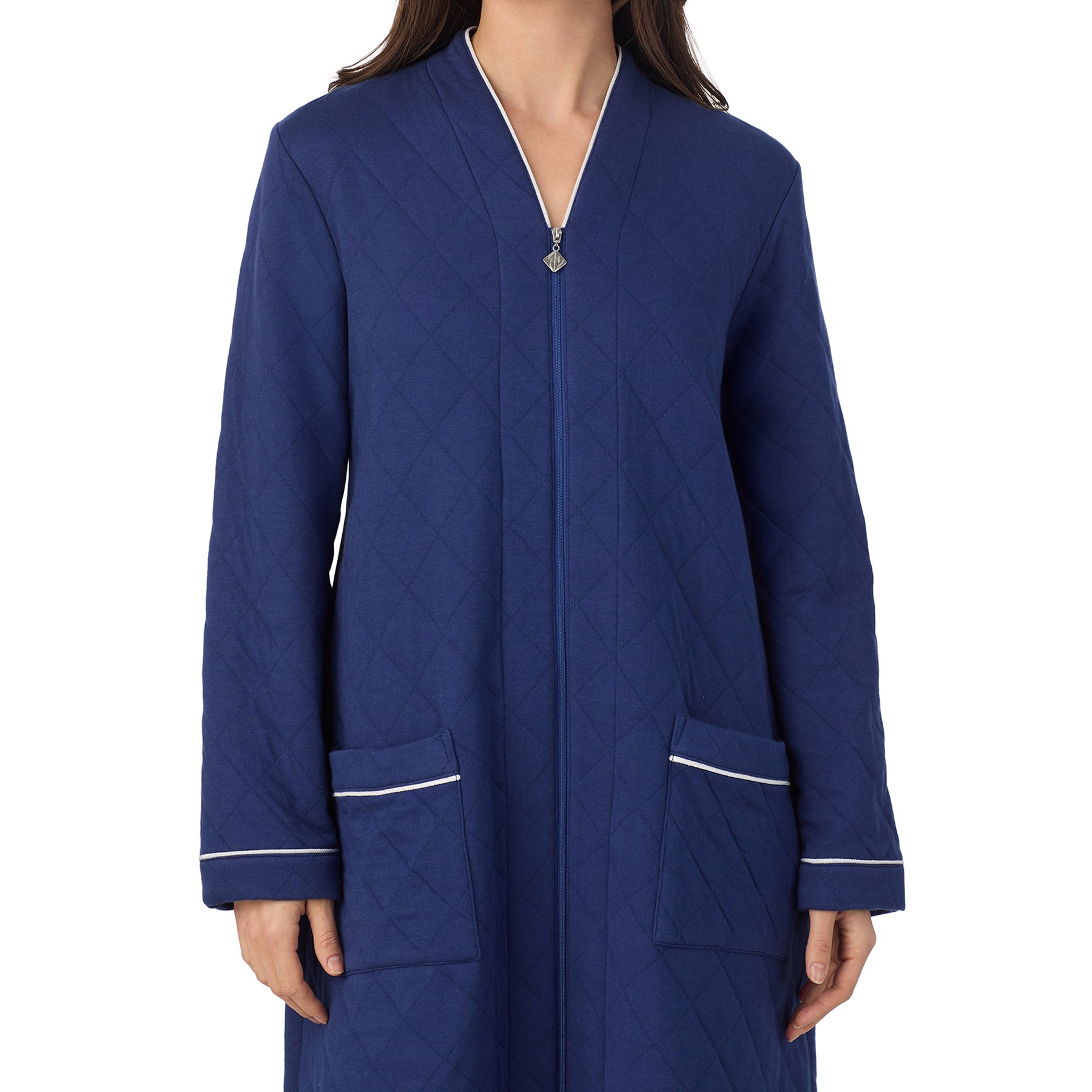 Close-up of quilted navy cotton zip robe with white piping trim and front pockets by Eileen West.
