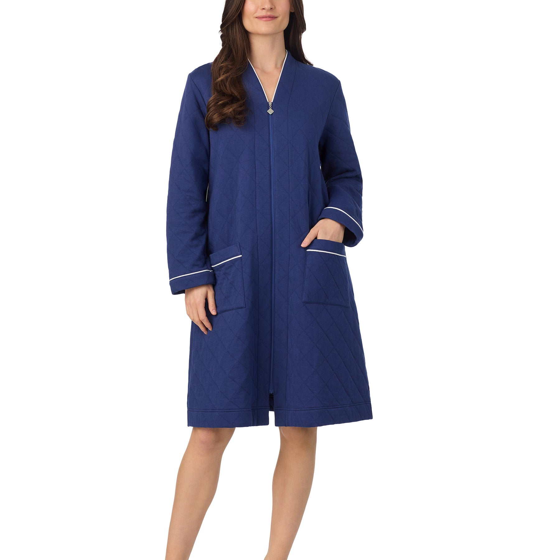 Woman wearing navy quilted Eileen West robe featuring a zip front and contrast piping on sleeves and pockets.
