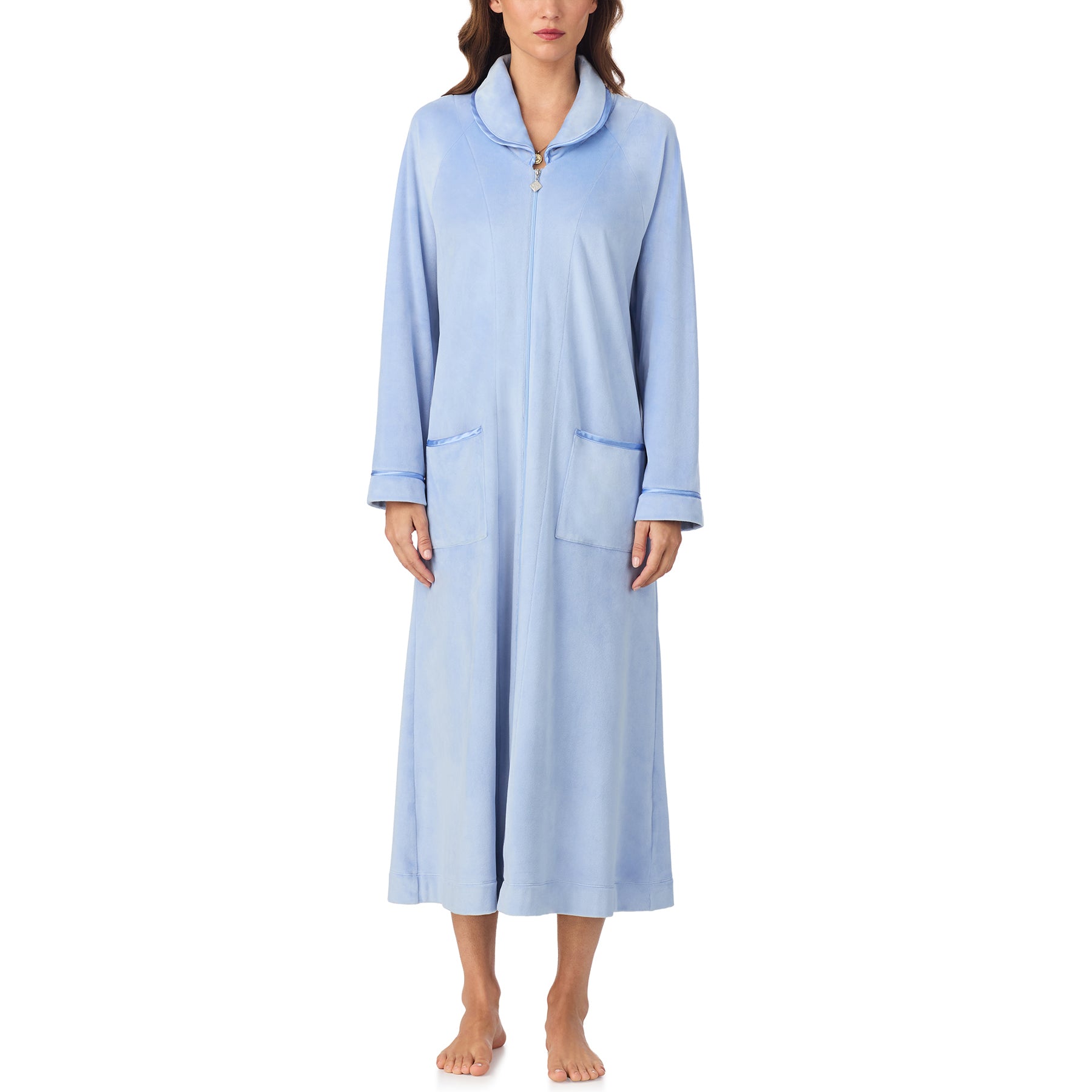 Front view of woman in full-length periwinkle velour robe with zip closure and front pockets.