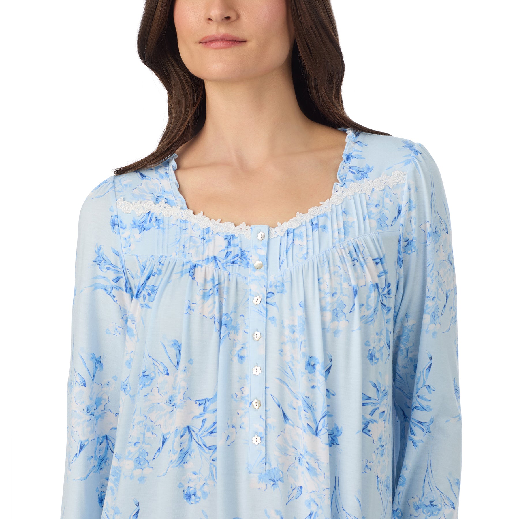 Close-up of a light blue floral nightgown showing lace-trimmed neckline and button front detail.