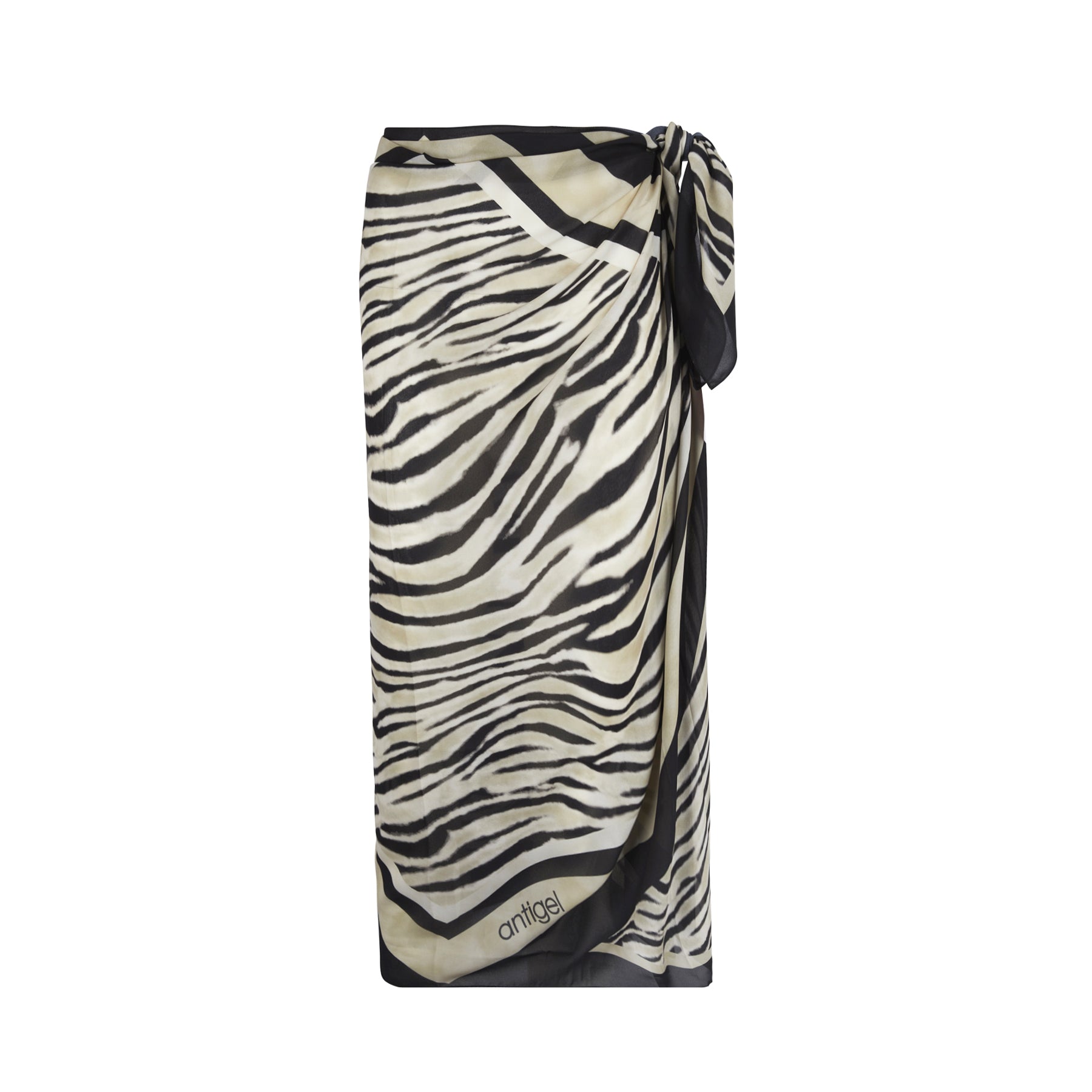 Zebra-print beach sarong in ivory and black with contrast border and side tie, photographed flat on a white background.