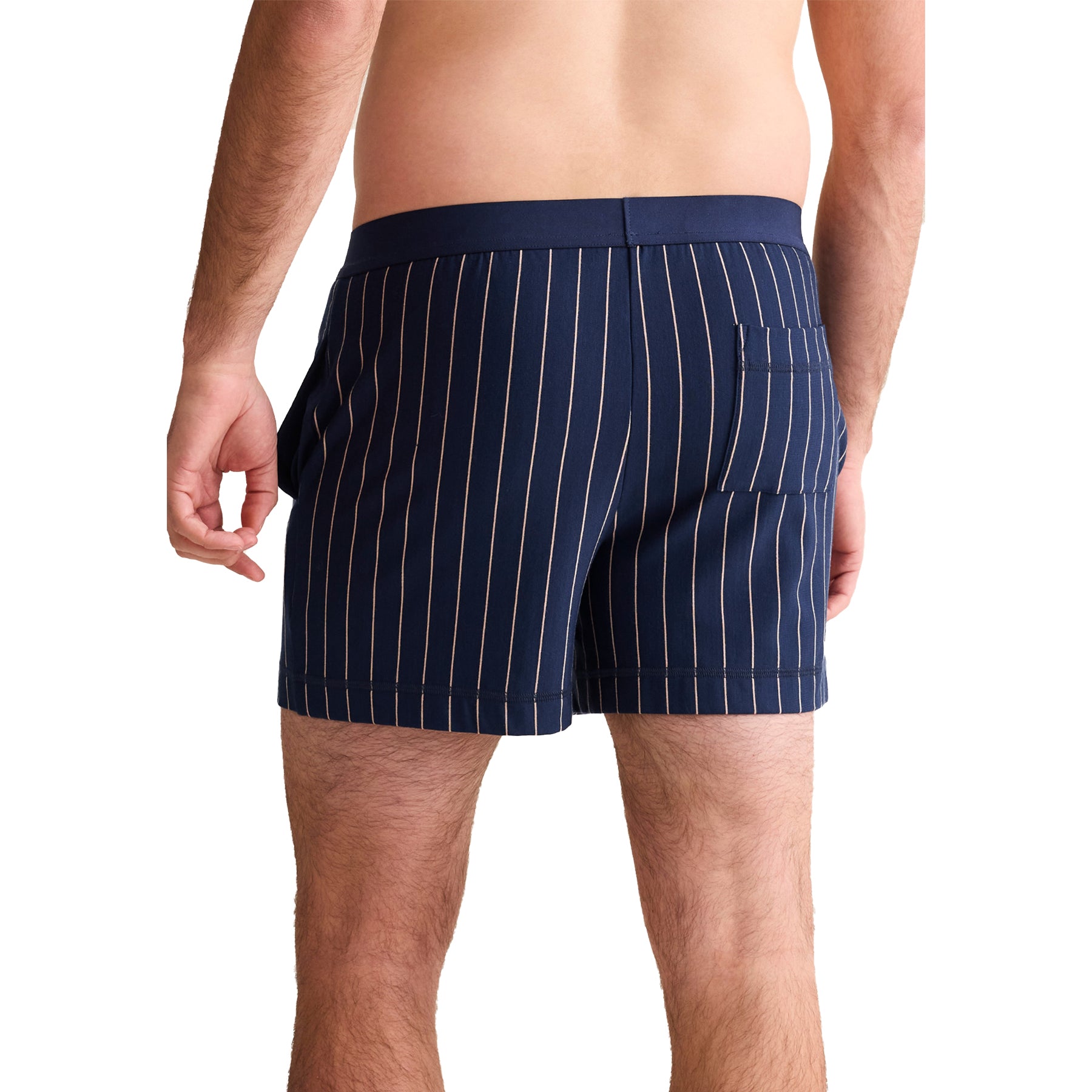 Back view of men’s navy striped boxer shorts with praline pinstripes and back pocket.