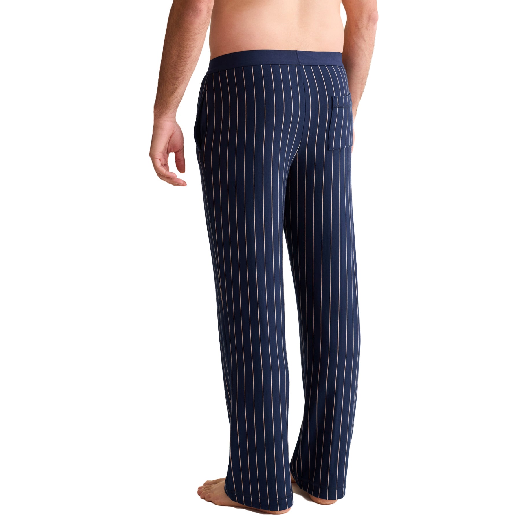 Back view of men’s navy striped pyjama pants with relaxed fit and back pocket.