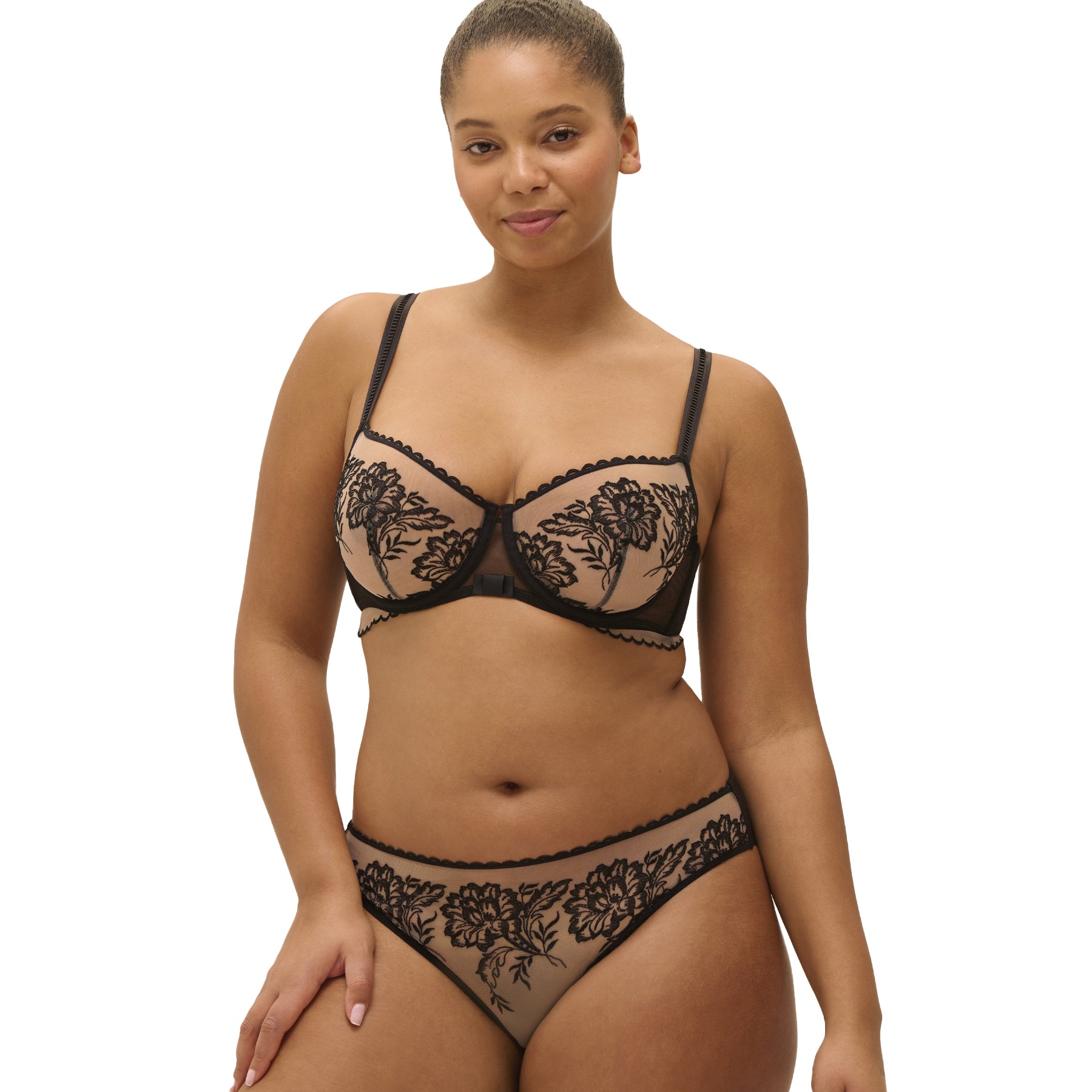 Model wearing black floral embroidered bikini with matching bra - front view.