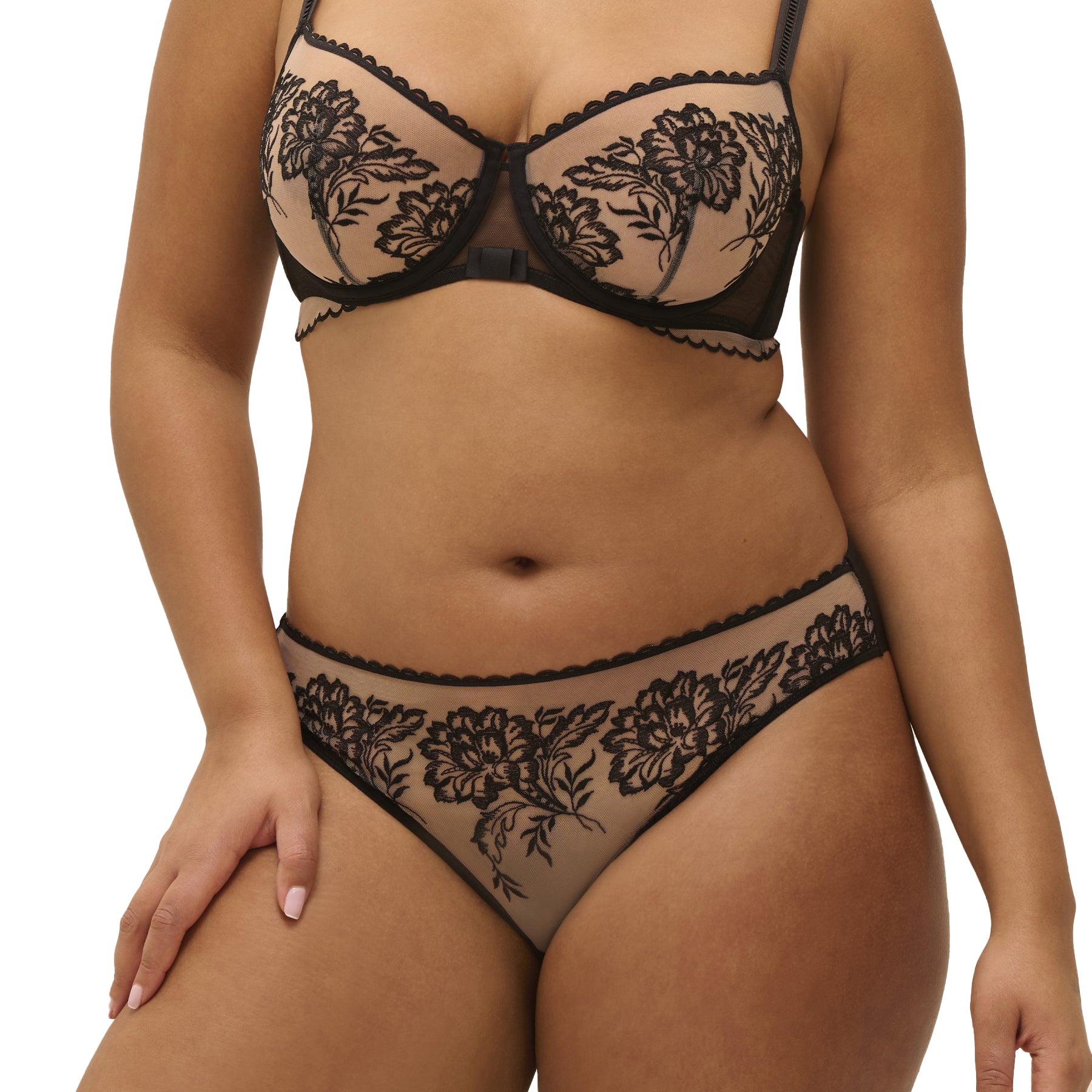 Close-up front view of black embroidered mesh bikini worn with matching bra.
