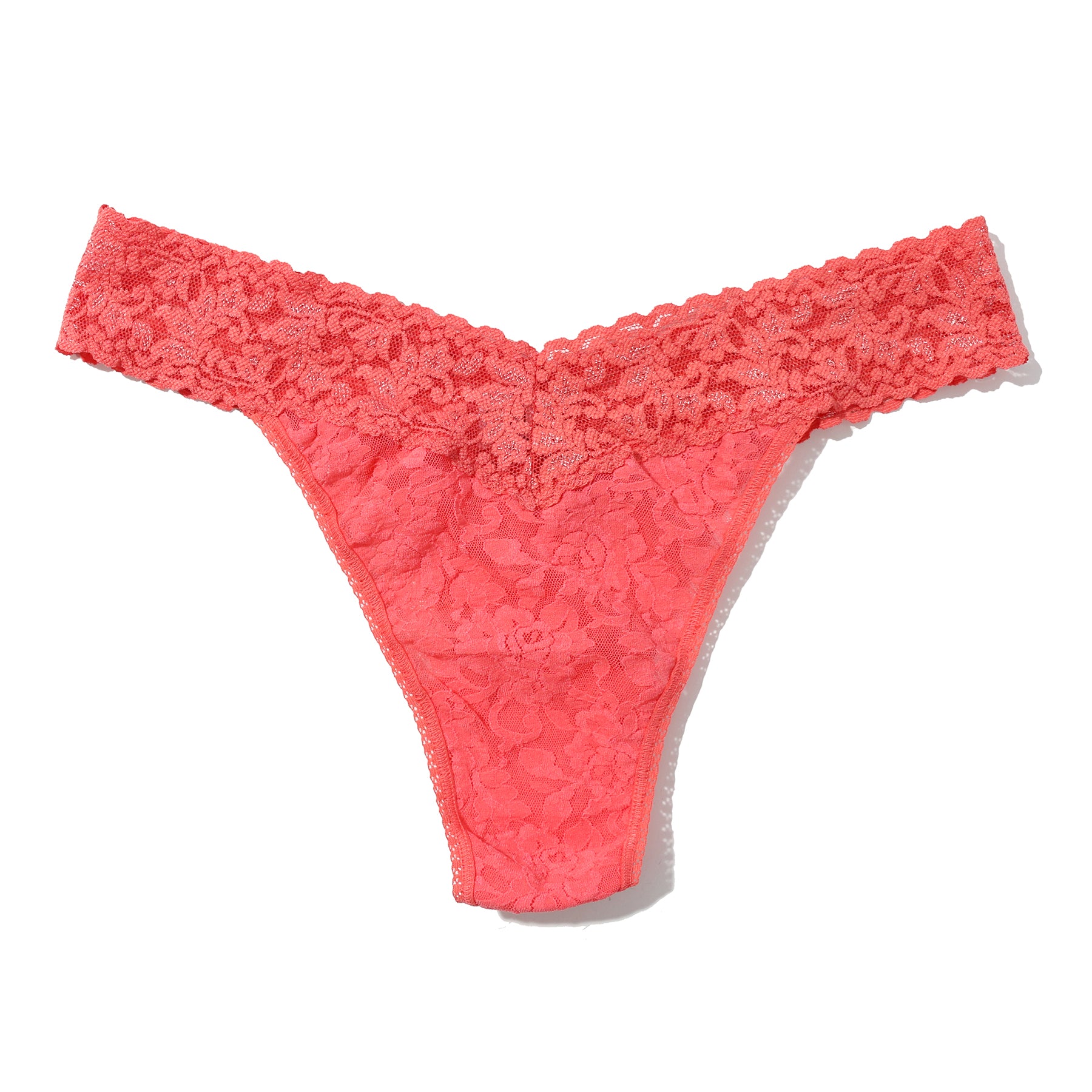 Hanky Panky lace original rise thong in  courageous coral orange pink, flat lay without model.