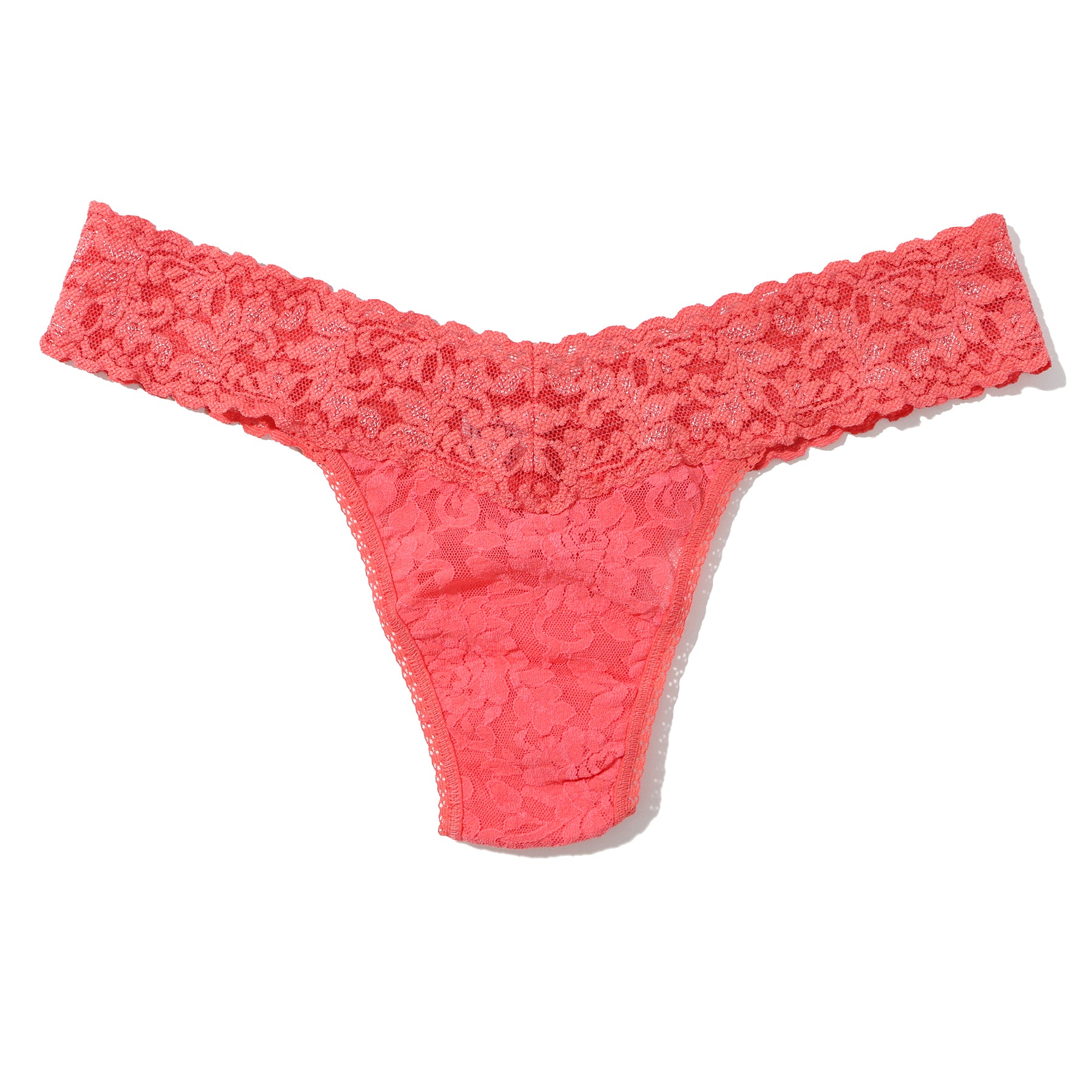 Hanky Panky lace low rise thong in courageous coral orange pink, flat lay without model.