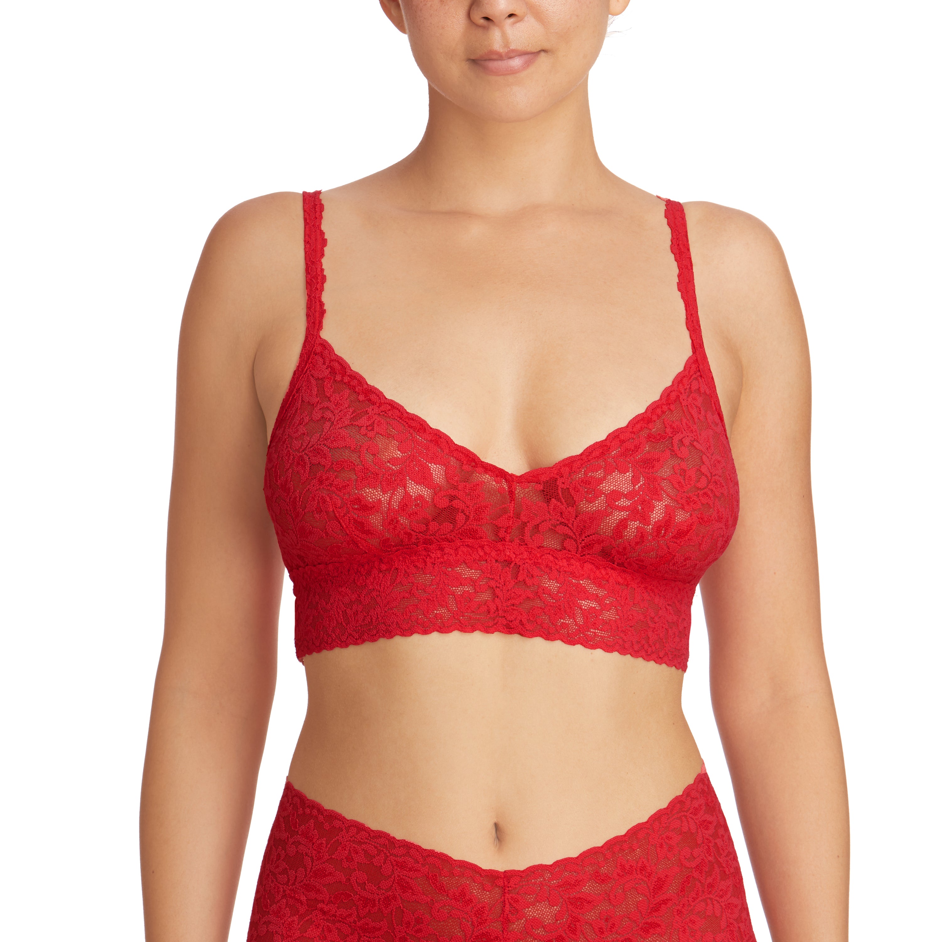 Red signature lace unlined wireless bralette with adjustable straps. Front view on model.