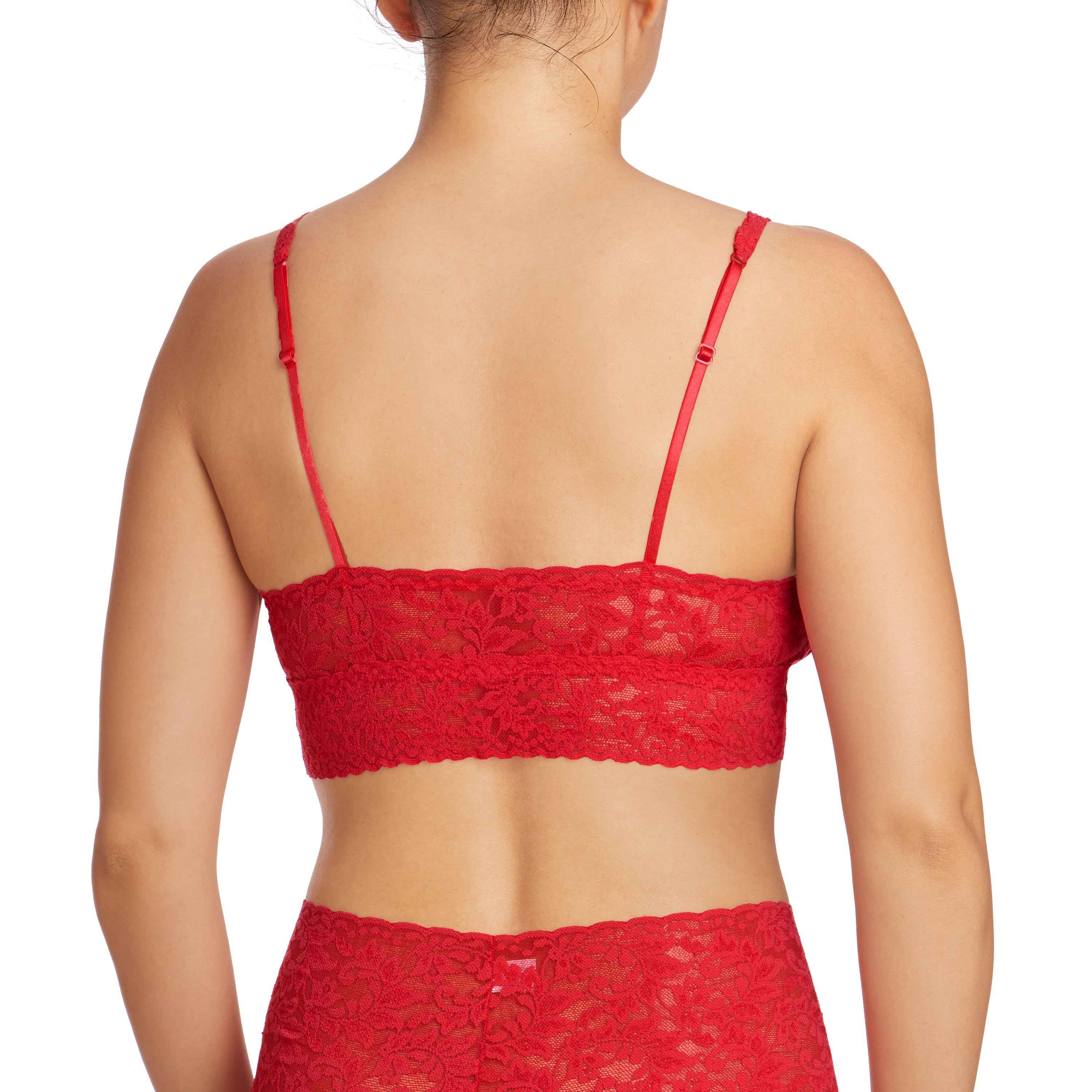 Red signature lace unlined wireless bralette with adjustable straps. Rear view on model.