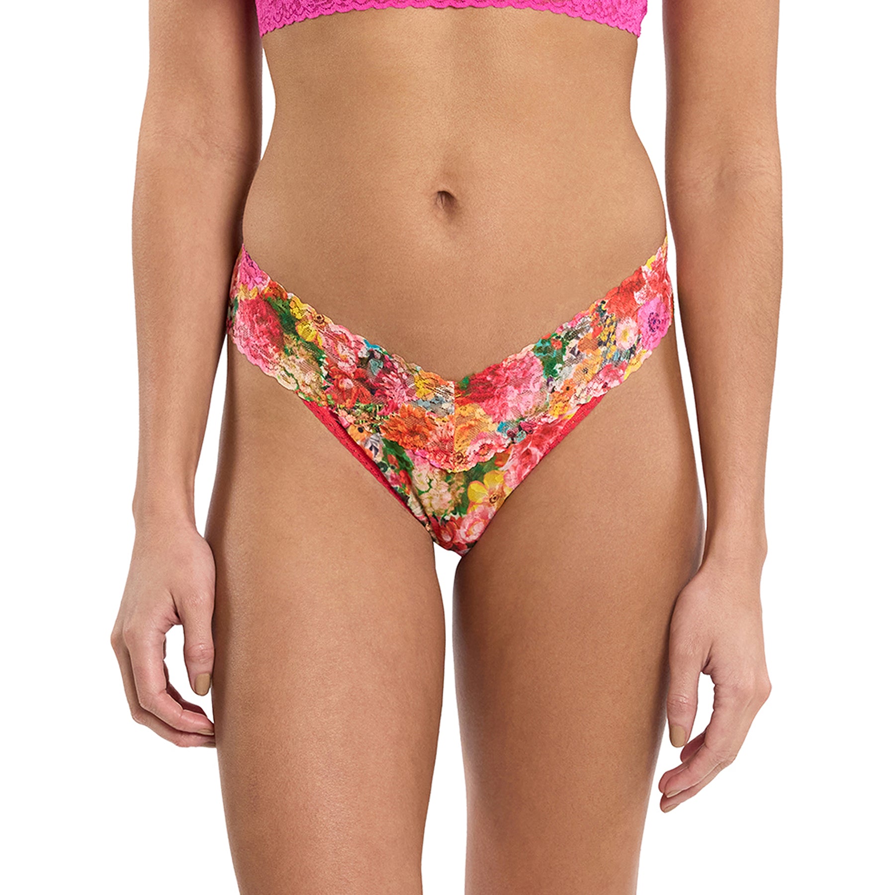 Front view of model wearing Hanky Panky Original Rise Thong in Floramania - highlighting the soft V-cut waistband and colourful floral lace detail.