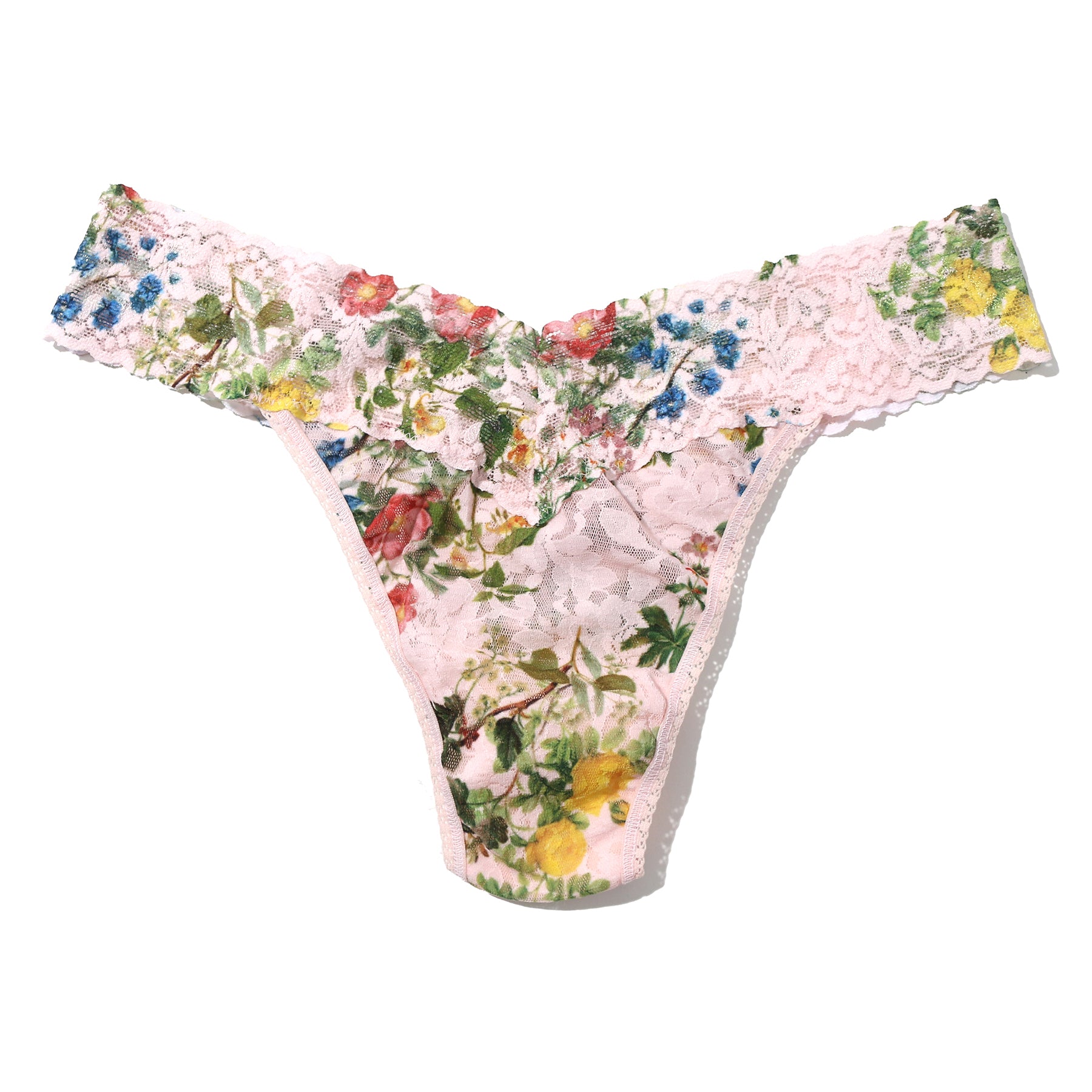 Printed lace original rise thong in overjoyed, with pink, green and blue florals on a light pink background. Flay lay without model.