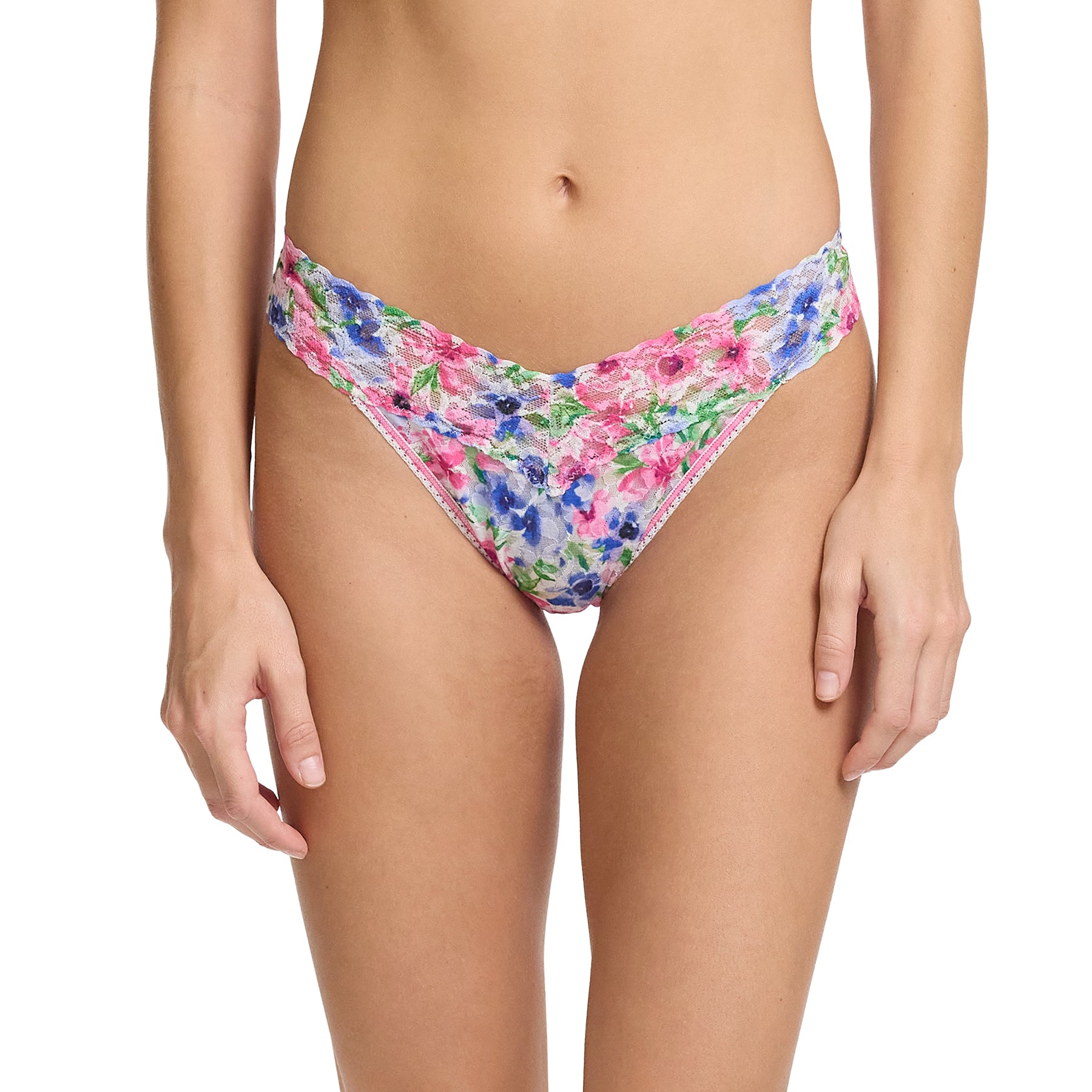 Hanky Panky printed lace original rise thong in paint and pour: pink, green and blue florals on a white background, front view on model.