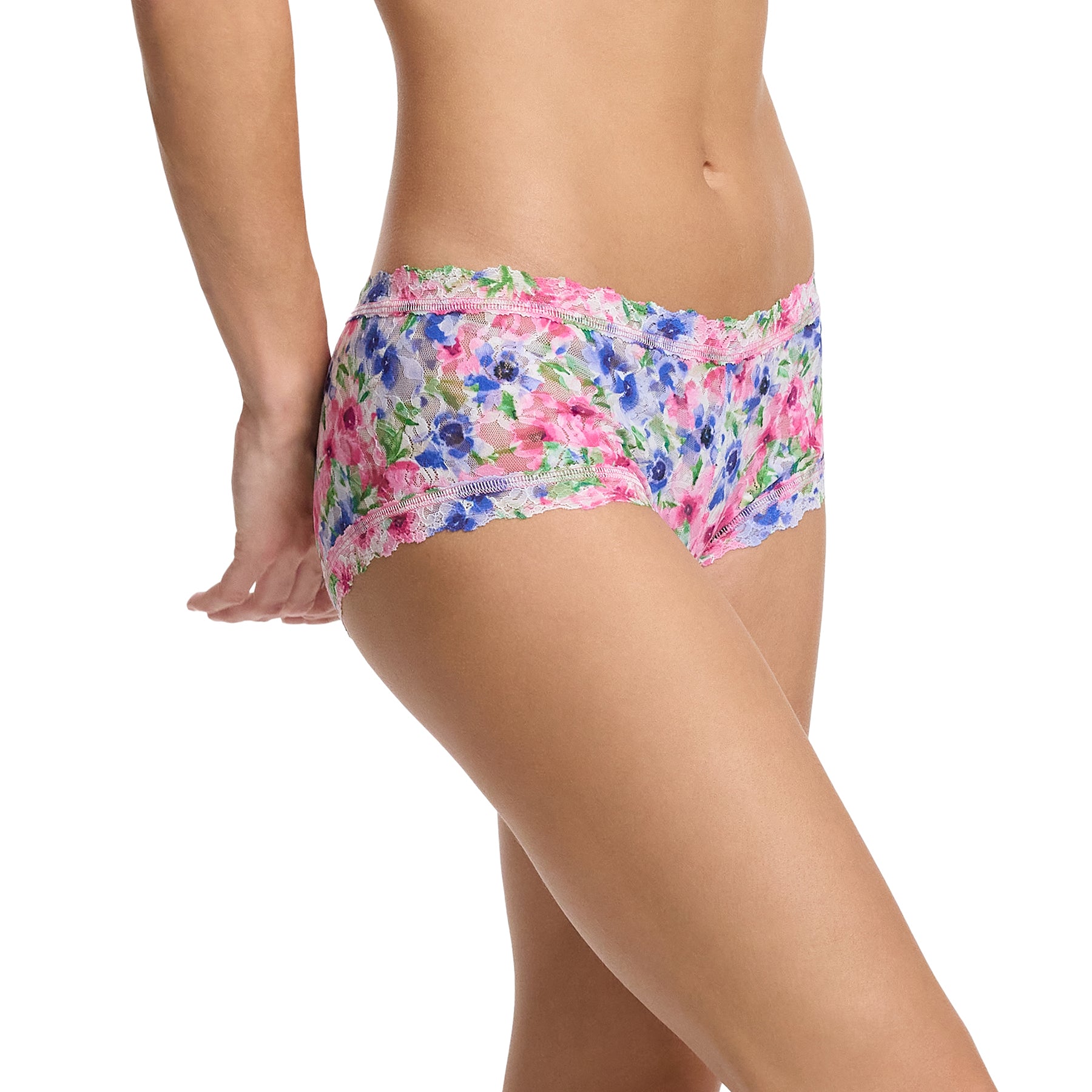 Hanky Panky printed mid-rise boyshort in paint and pour: pink, green and blue florals on a white background, side view on model.