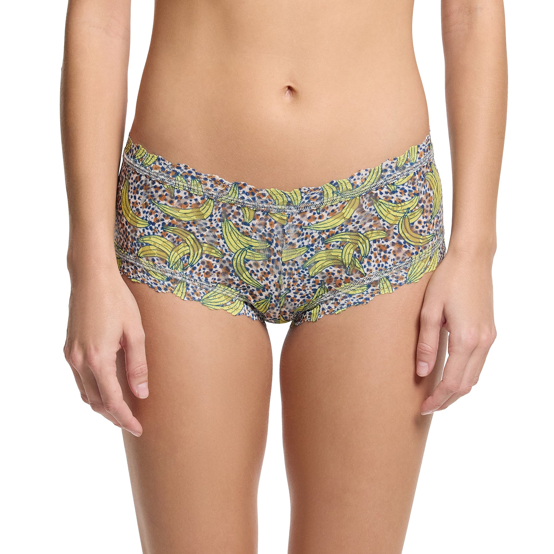 Hanky panky printed lace boyshort in pick me, yellow banana print on a brown and navy dot print background. Front view on model.