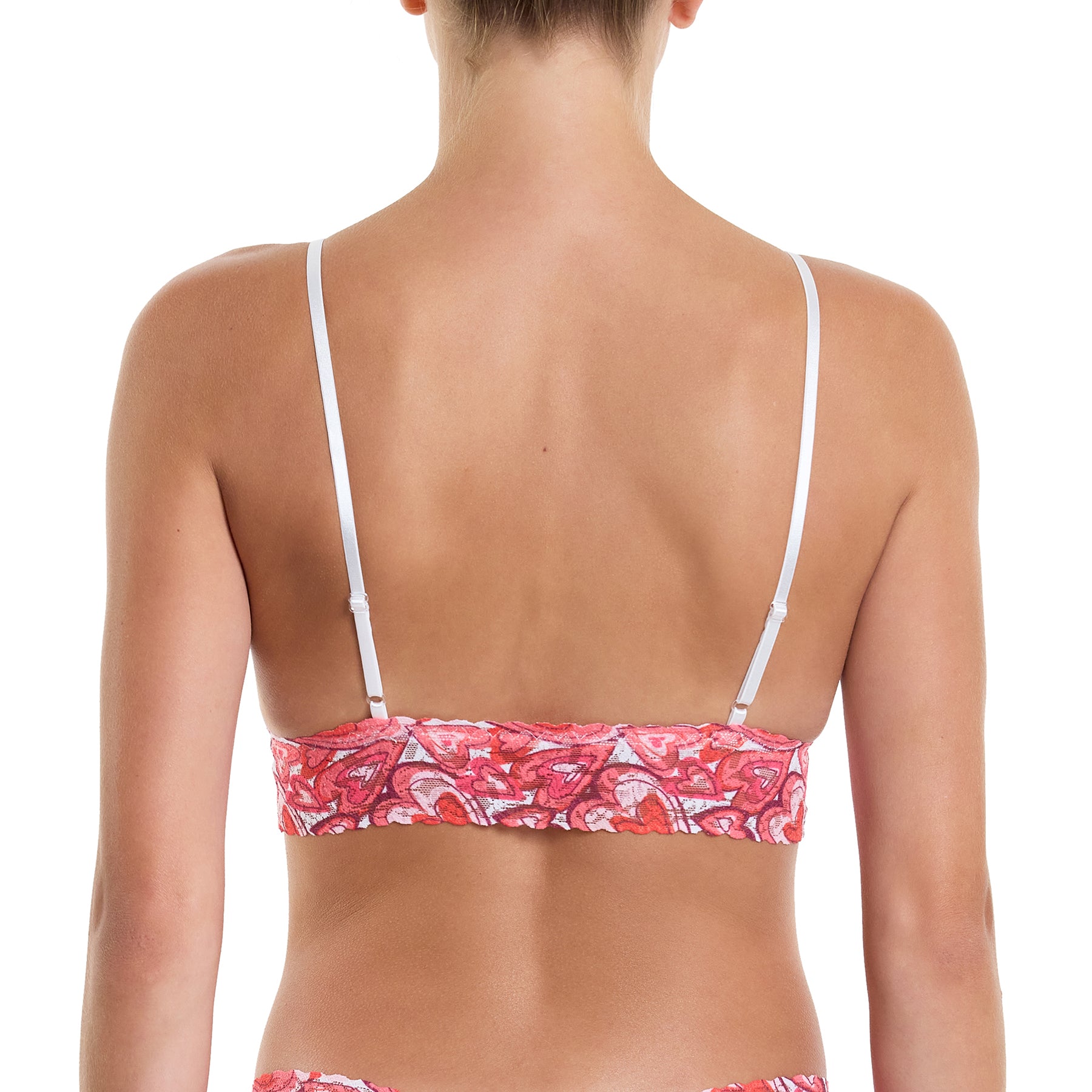 Lace triangle bralette in lots of love multi heart print lace in pinks and reds. Rear view on model.