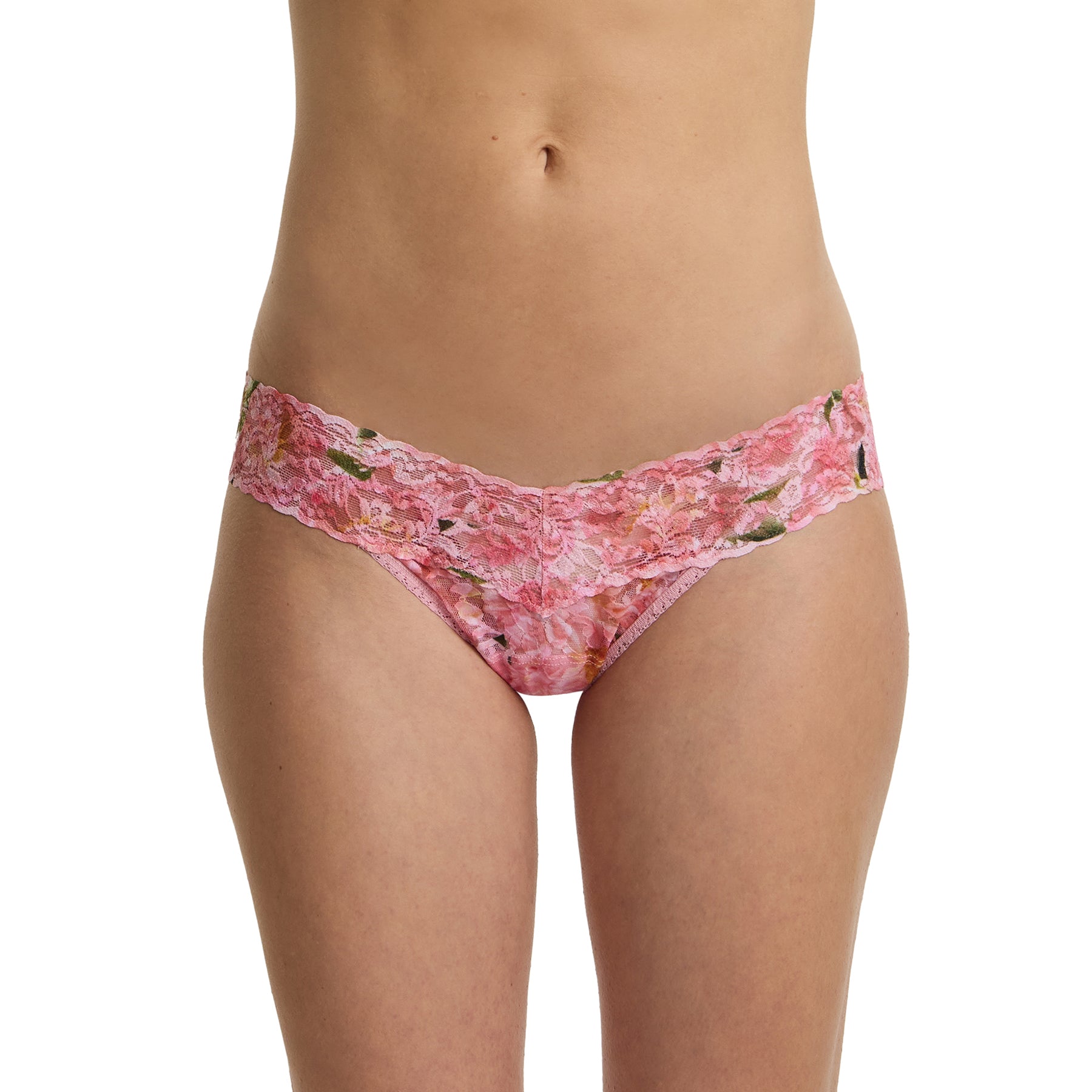 Model wearing pink floral lace low rise thong in the Dancing Petals print with scalloped lace waistband front view