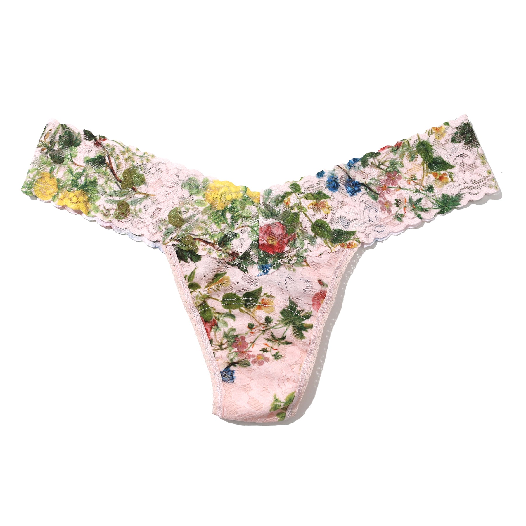 Printed lace low rise thong in overjoyed, with pink, green and blue florals on a light pink background. Flat lay without model.