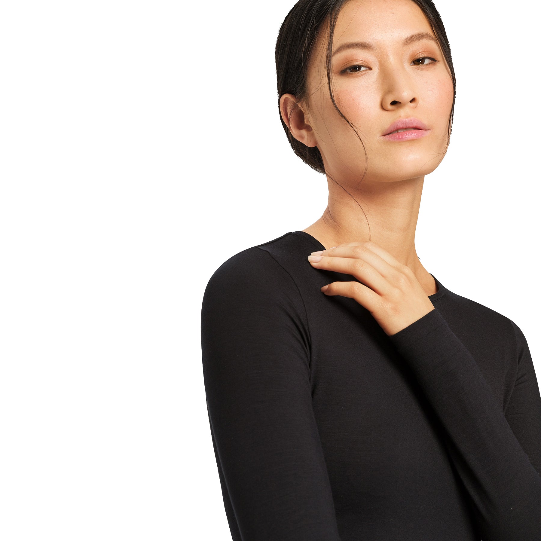Hanro Soft Touch black long sleeve top close-up on model, highlighting ultra-soft fabric, crew neckline, and clean seams