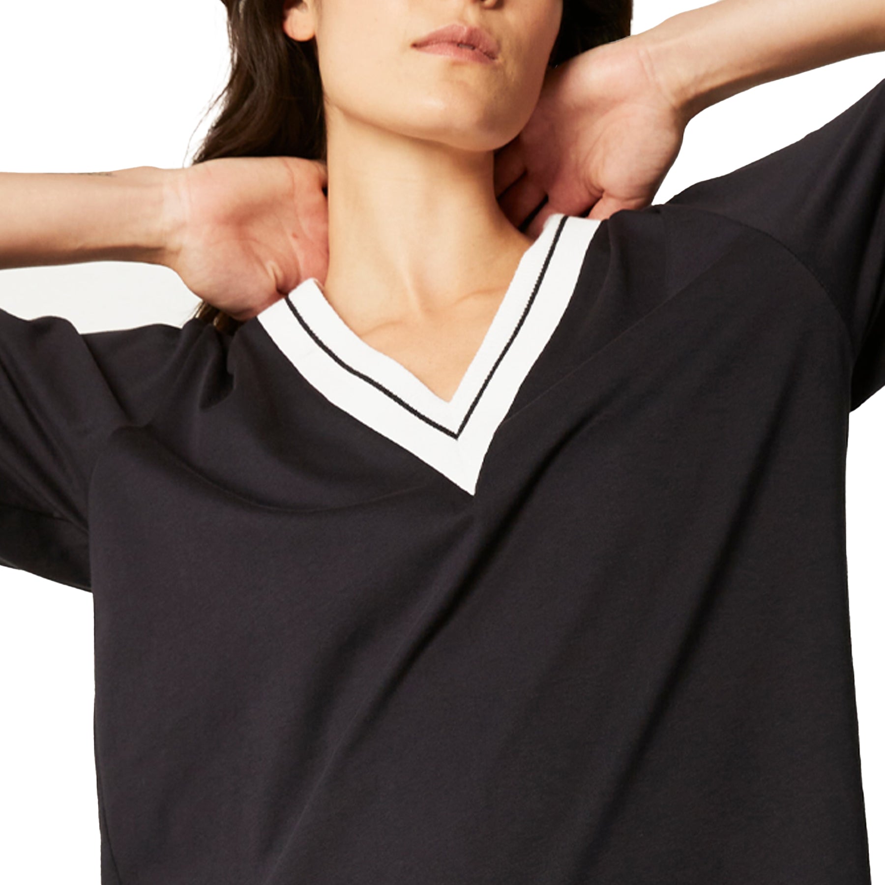 Close-up of navy nightdress with white V-neck trim and contrast detail on neckline