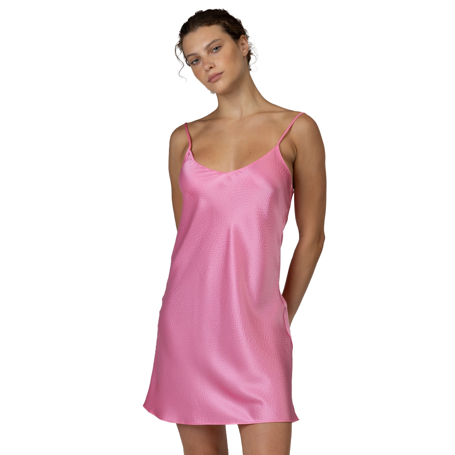 Close-up front view of pink satin chemise with soft sheen and delicate spaghetti straps
