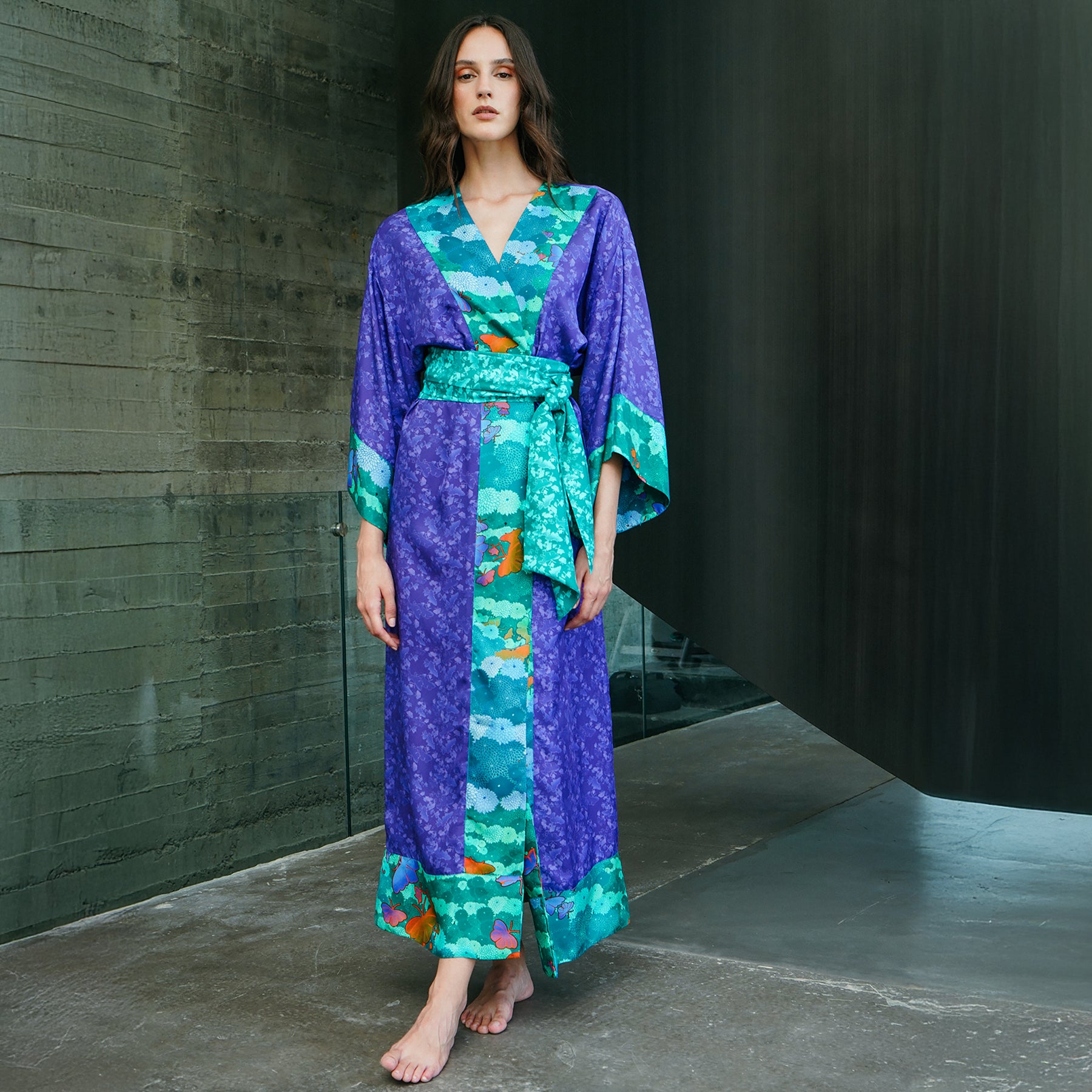 Silk kimono robe by karma on the rocks in Violet-niwa-teal. Front view on model.