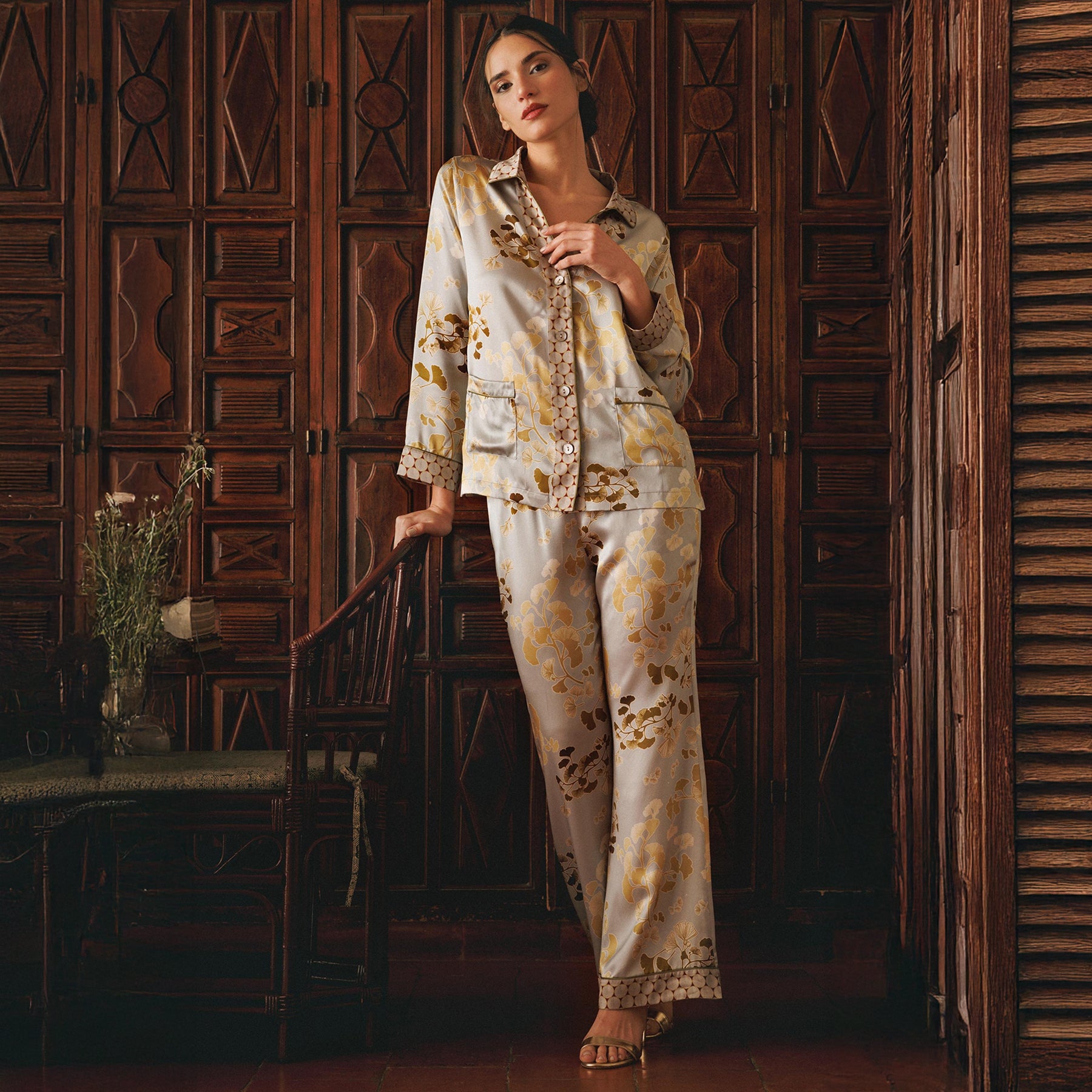 Kazari gold/bronze gingko printed silk classic mother of pearl button up pyjama set. Front view on model.