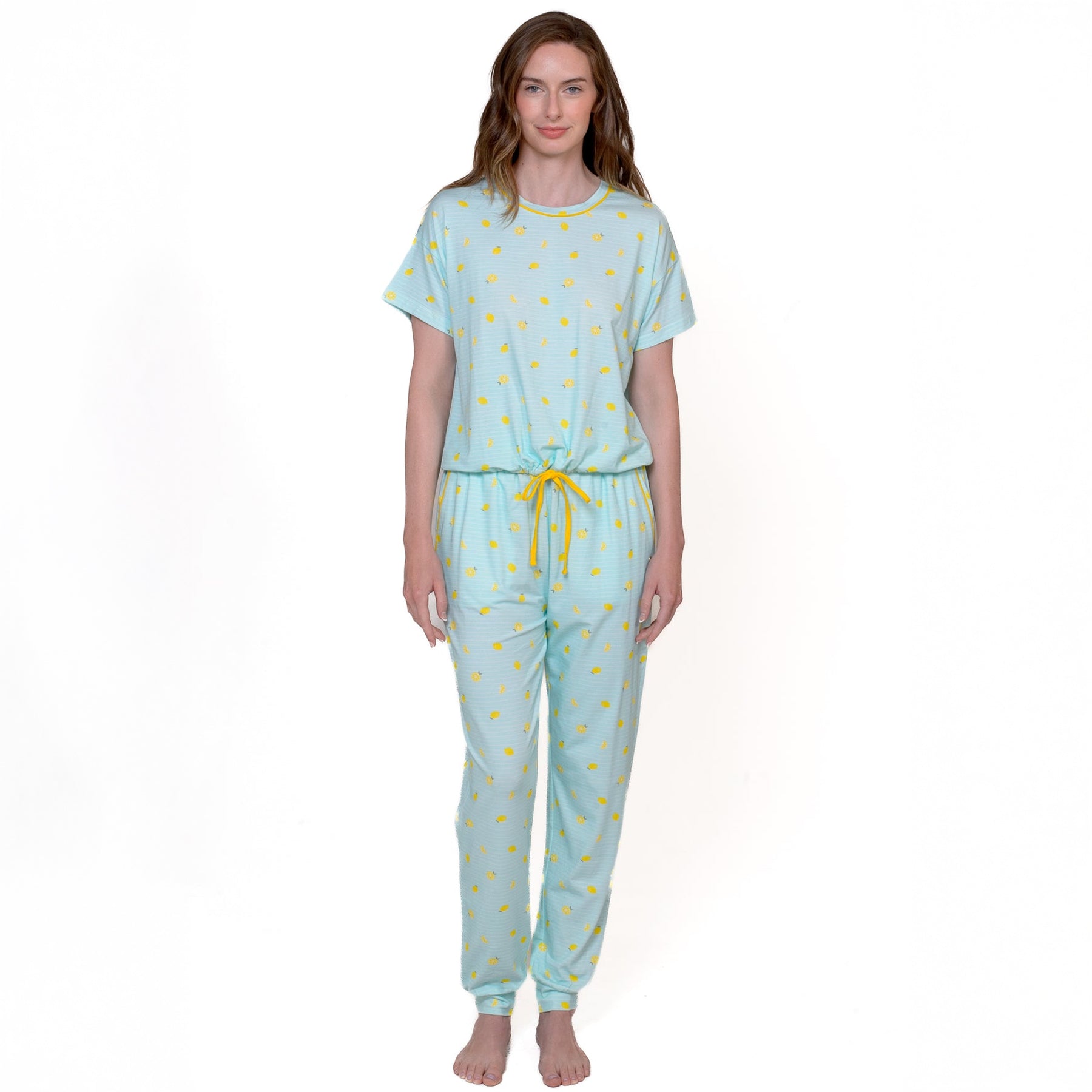Woman wearing aqua short sleeve pyjama set with yellow lemon print - front view of drawstring jogger pants and top.