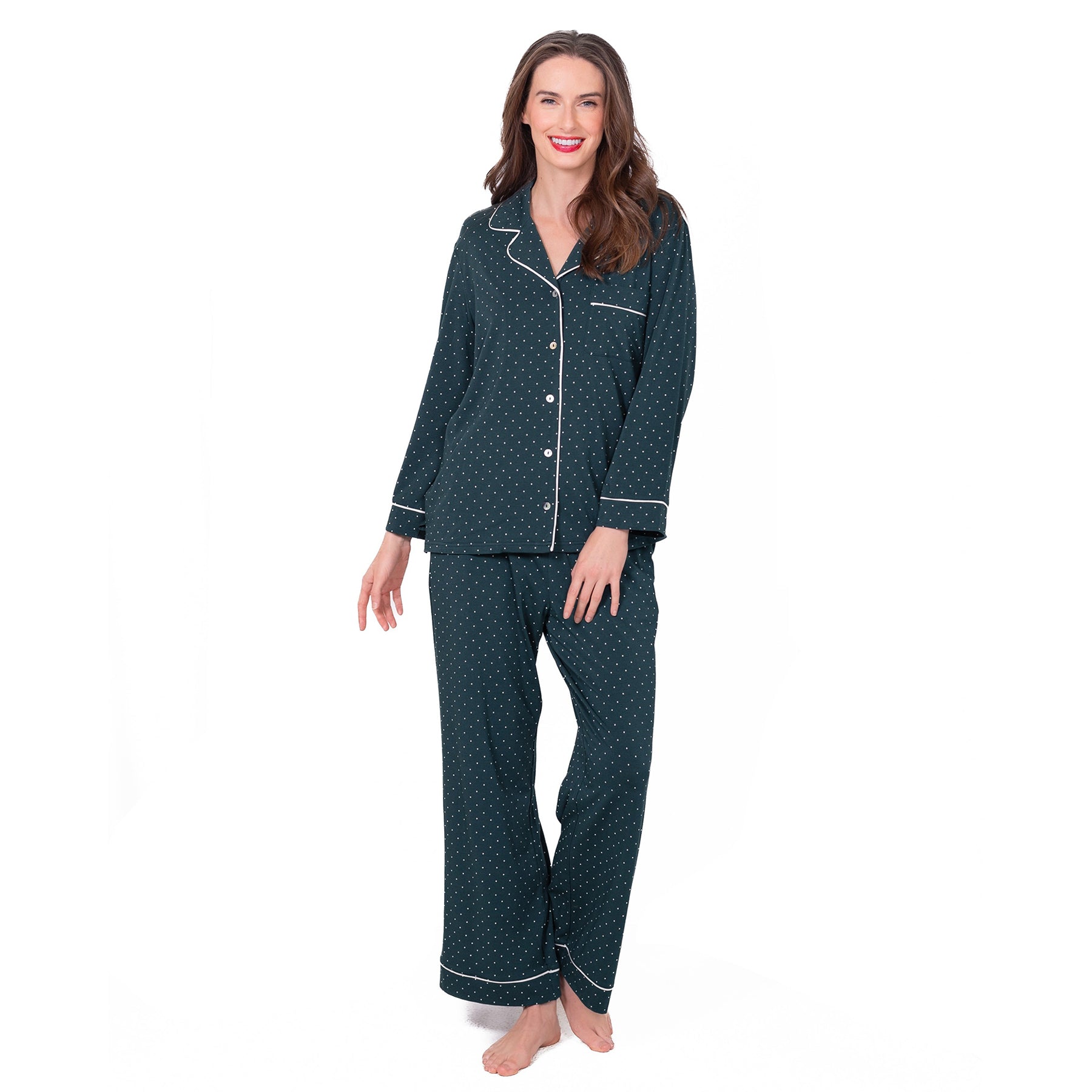 Woman wearing LatteLove Green Dots pajama set with long sleeve button-up top and drawstring pants.