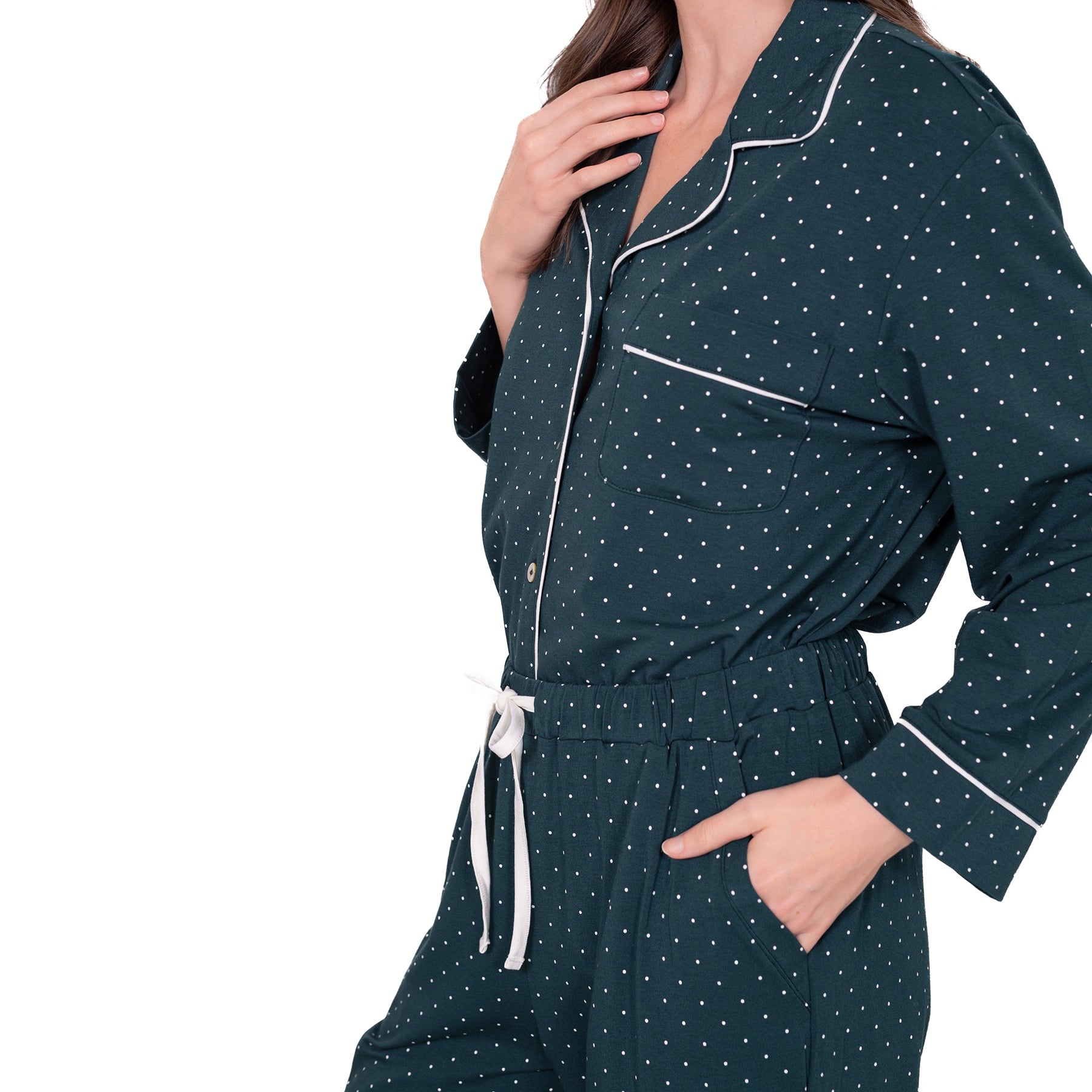 Close-up of LatteLove Green Dots pajama top and drawstring pants with white piping details.