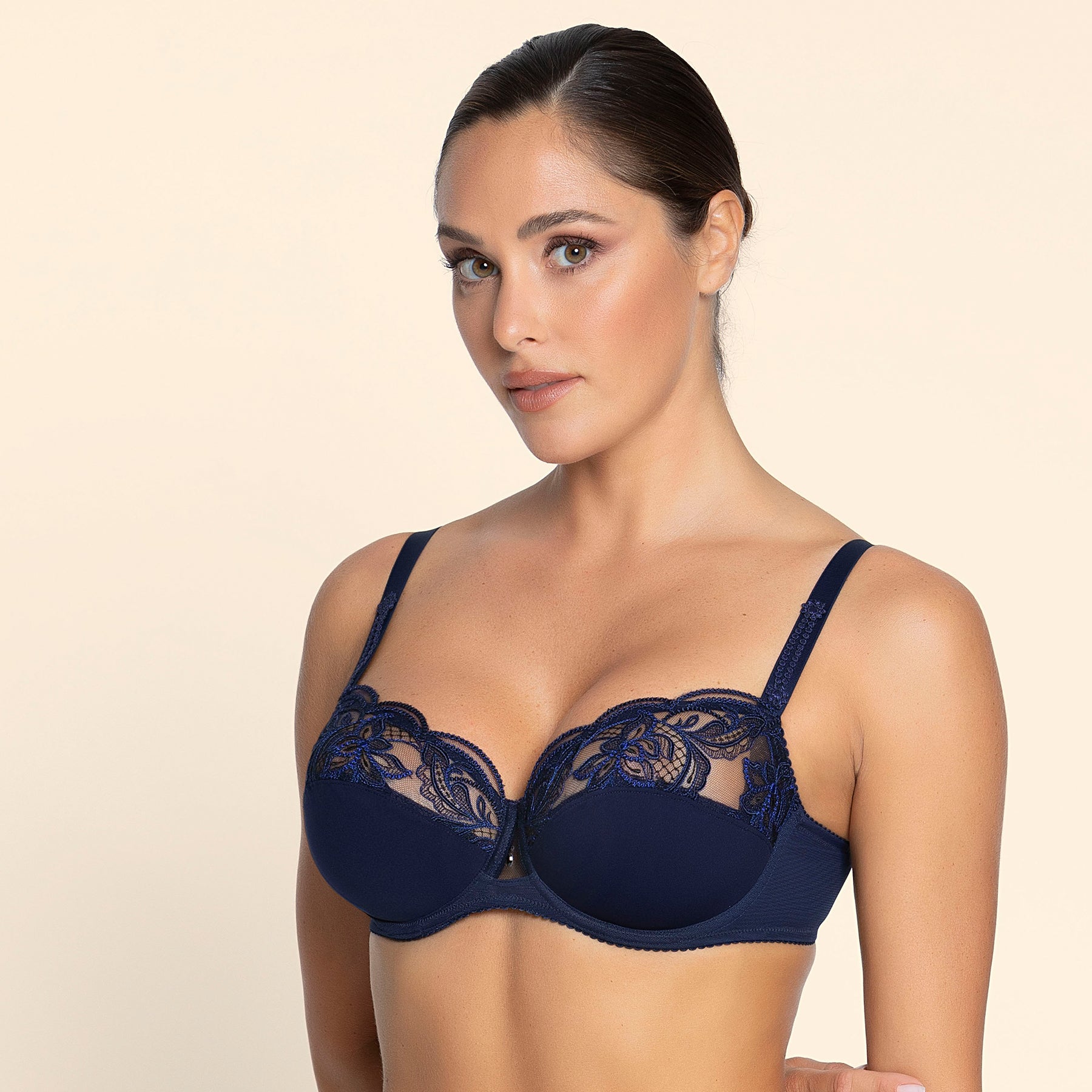Lise Charmel Éclat Couture Demi Fuller Cup Bra Bleu Night on model – luxury navy embroidery with demi full cup support for a lifted, rounded shape.