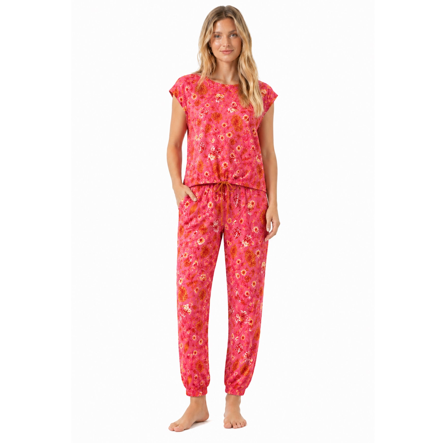 Pink botanical print women’s pyjama set with short sleeve top and drawstring pants, full front view