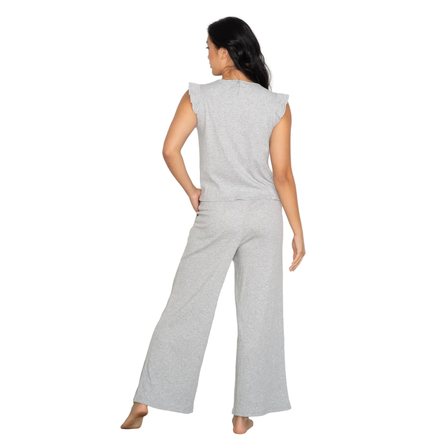 Grey two-piece loungewear set with feminine ruffle shoulder detail and fluid silhouette, back view on model