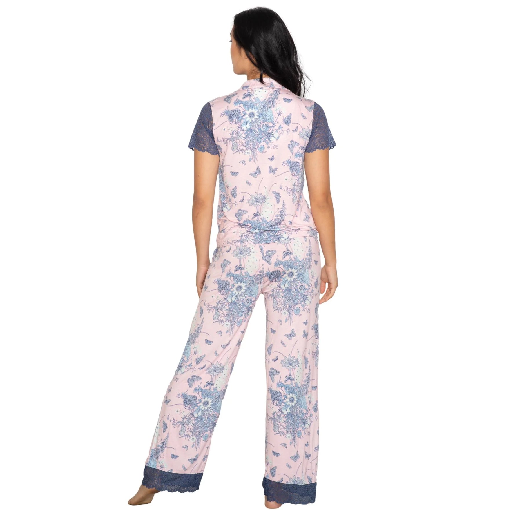 Back view of pink floral pajama set with blue lace accents and flowing wide-leg pants