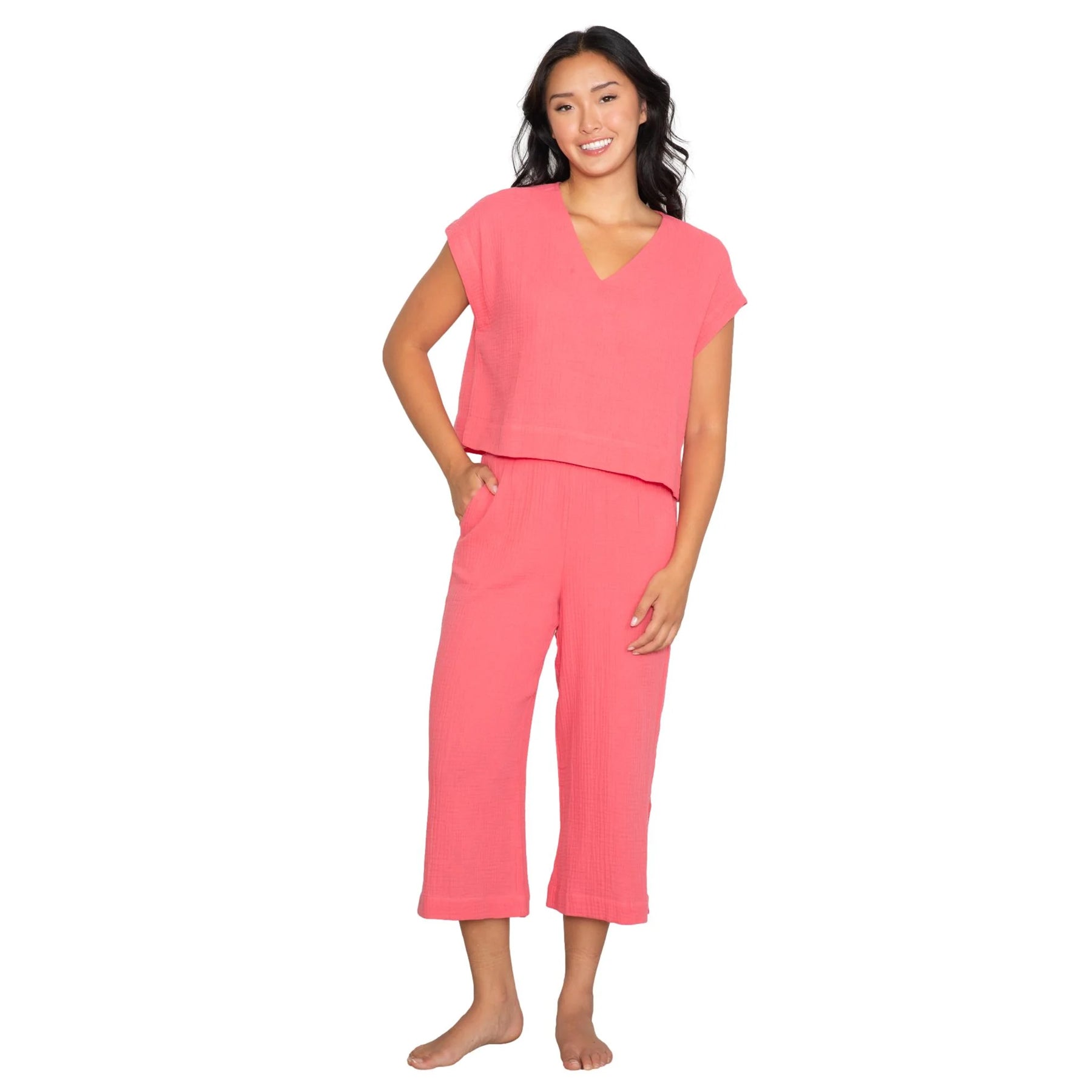 Bright pink relaxed-fit two-piece set with short sleeve top and wide-leg cropped pants, front view