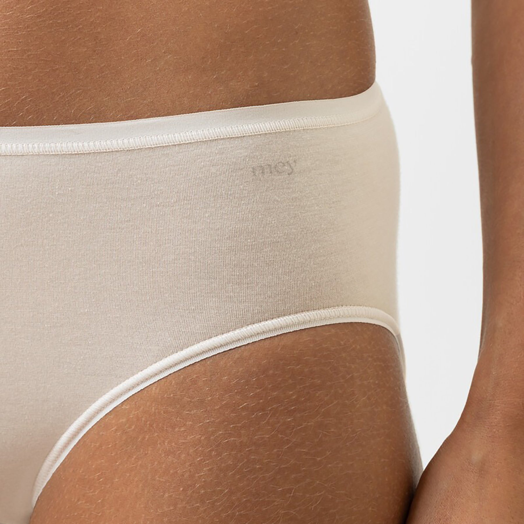 Close-up of Mey Bailey beige organic cotton bikini panty showing smooth waistband and soft fabric texture