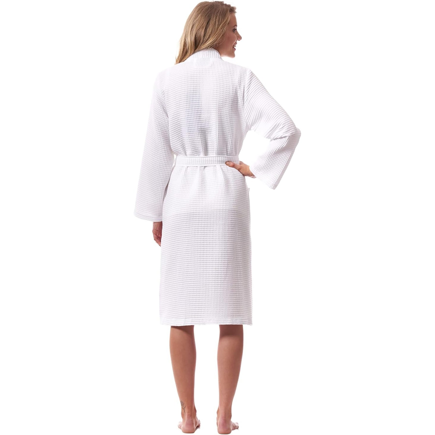 Back view of woman in white waffle robe – unisex cotton robe with belt and soft texture.