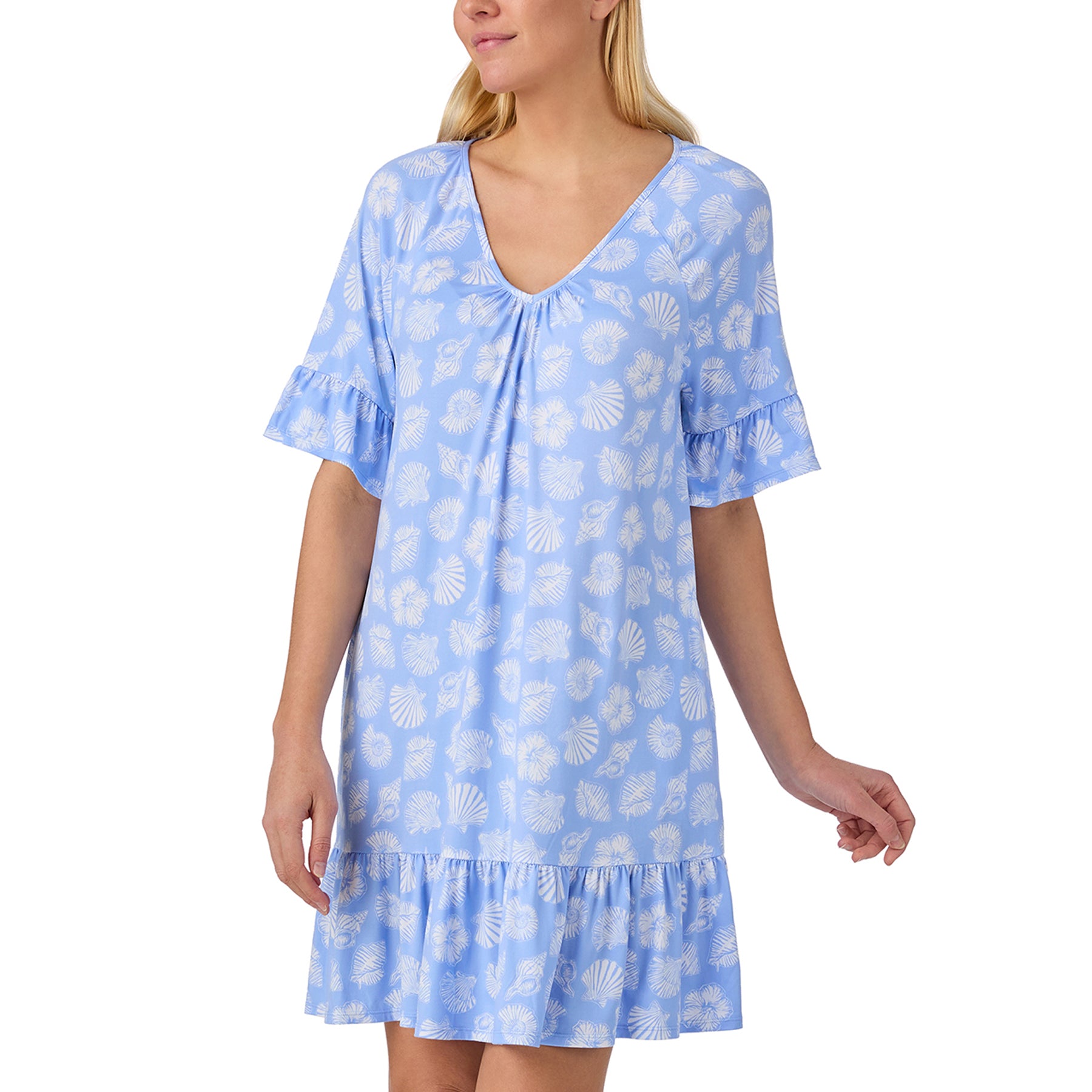 Ellen Tracy short sleep shirt in a soft blue seashell print featuring a breezy silhouette, feminine flutter sleeves, practical side pockets, and a playful ruffle hem.