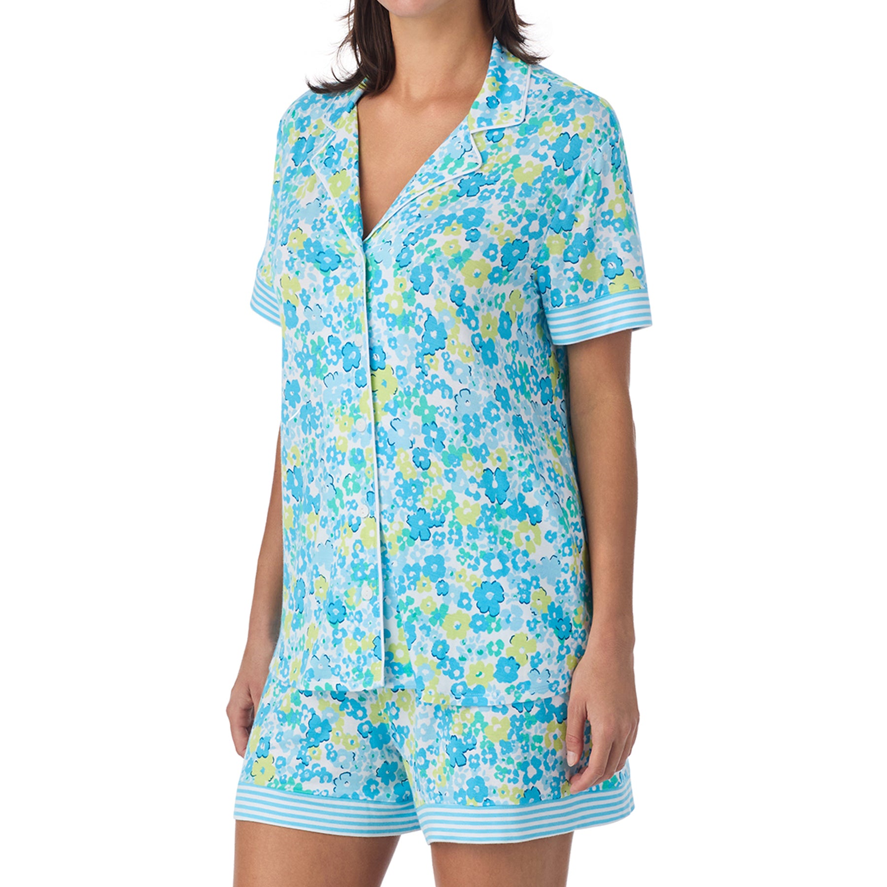 Close-up of floral pyjama top with collar and striped sleeve trim in soft cotton fabric