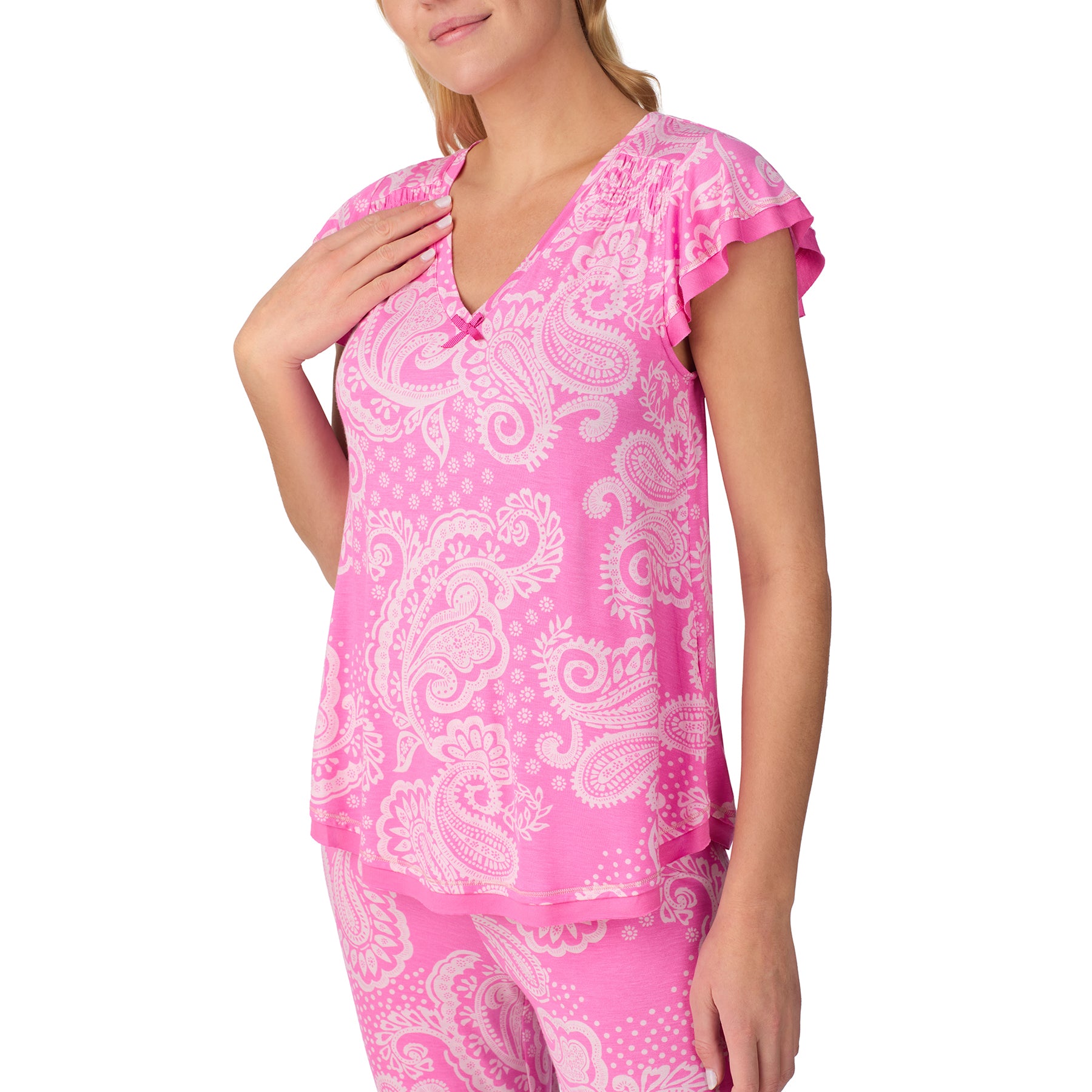 Close-up of the pink paisley pyjama top highlighting the V-neckline, ruffled sleeves, and soft drape.