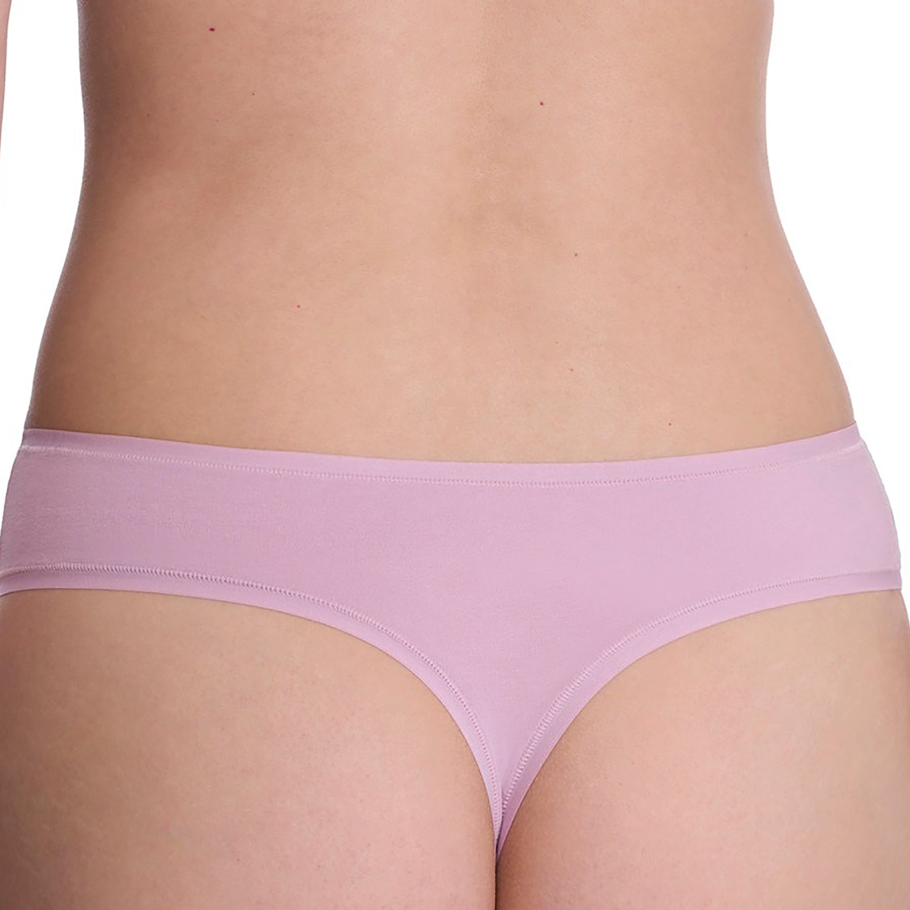 Seamless pima cotton mid-rise thong in rose mist dusty rose purple. Rear view close up on model.