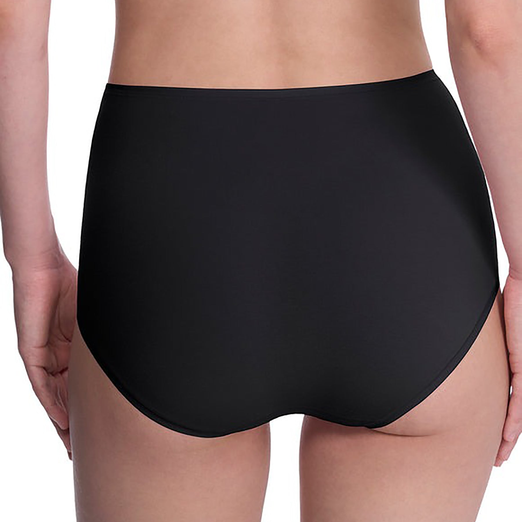 Seamless pima cotton high-rise full brief in black. Rear view close up on model.