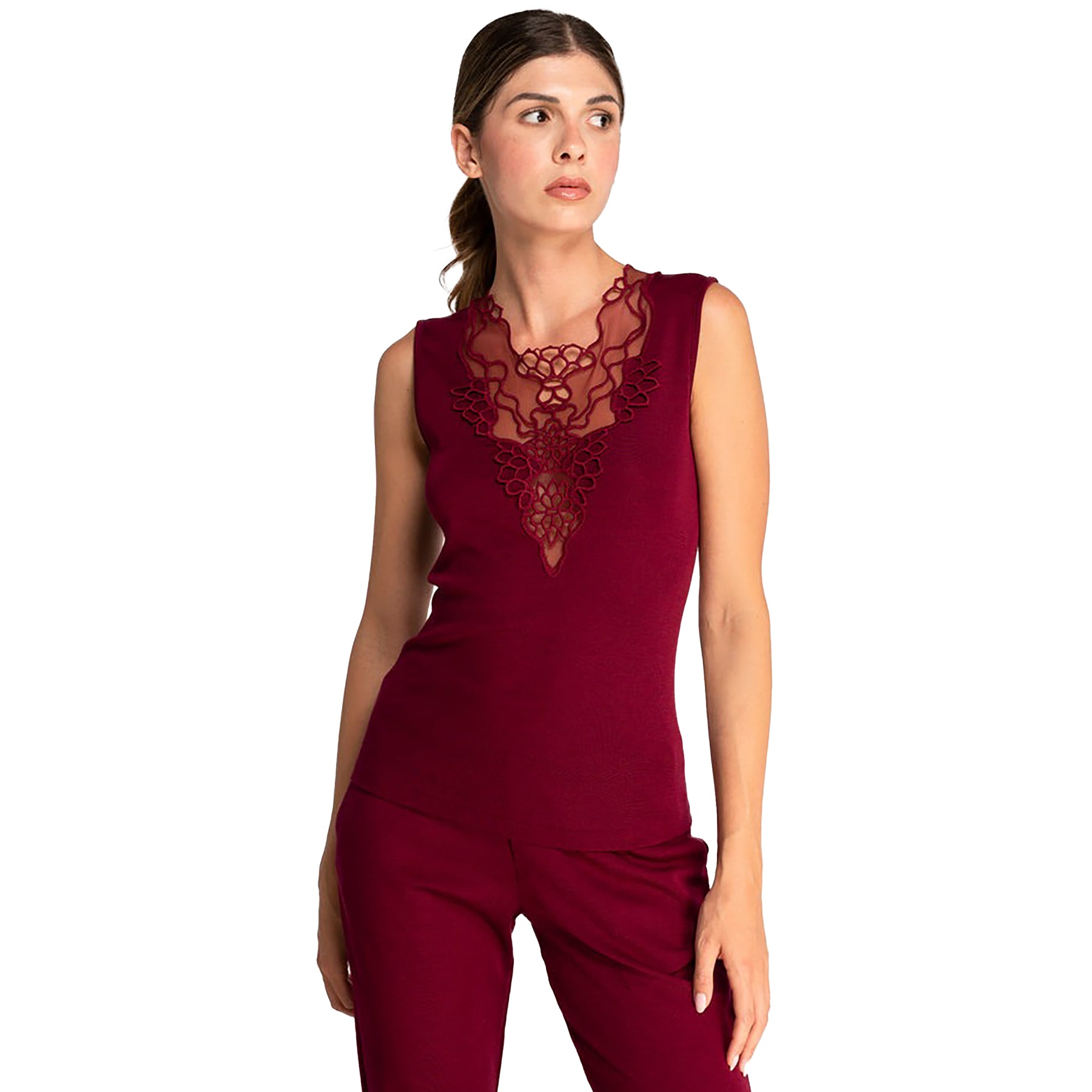 Sleeveless knit top in burgundy sangria made of wool and silk with Guipure lace embroidered neckline. On model front view.