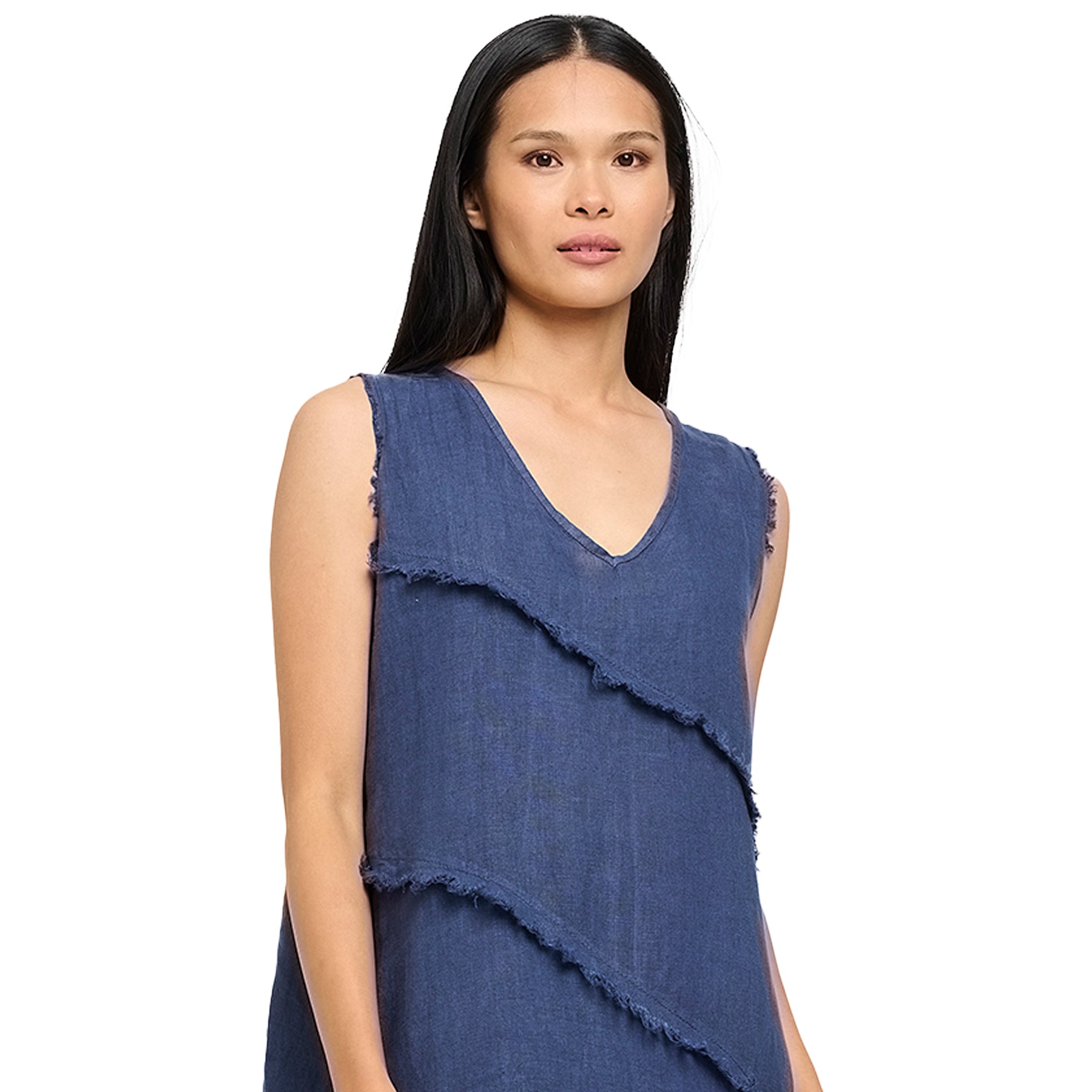 Close-up of woman wearing a navy sleeveless V-neck dress with diagonal fringe detail - casual chic summer style.