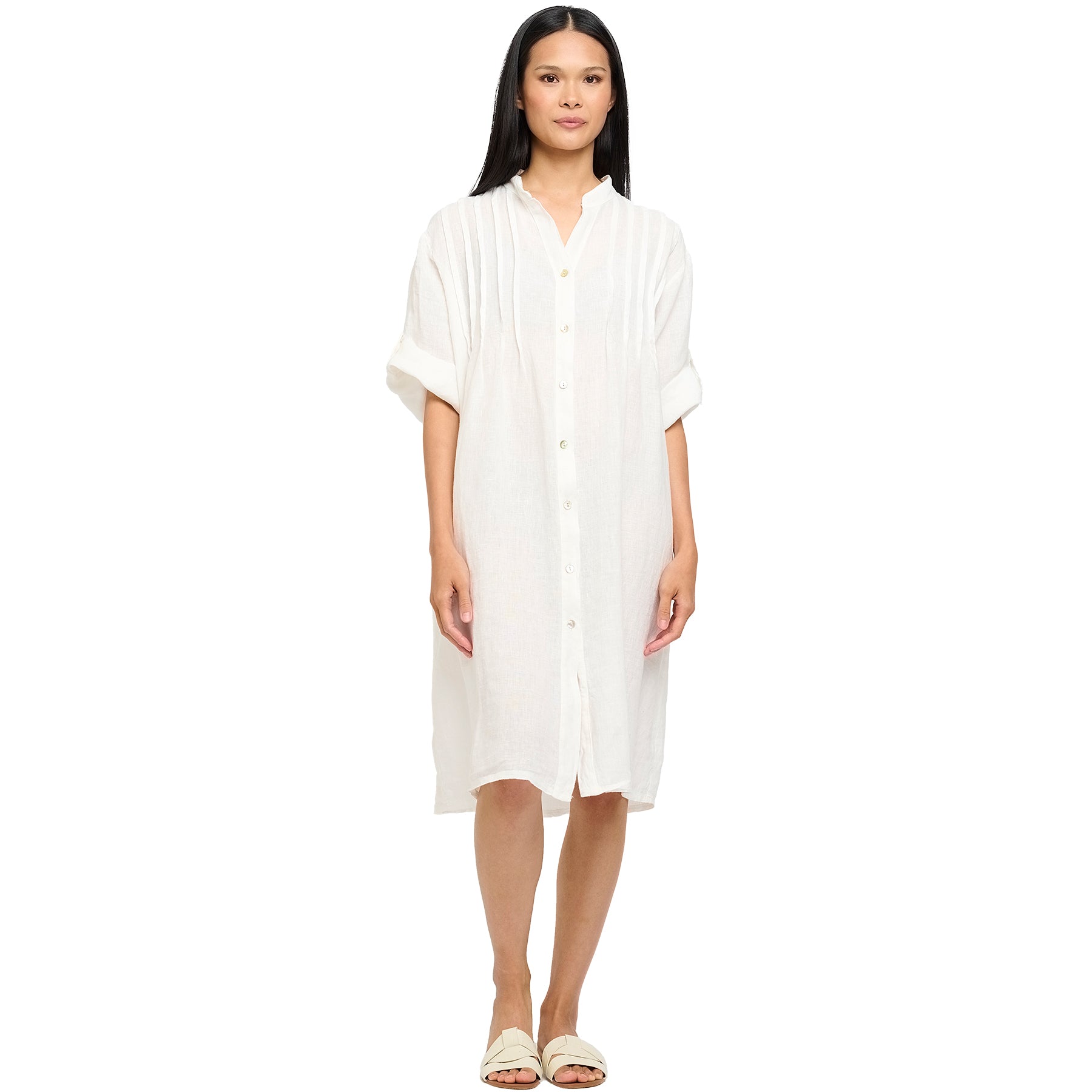 Roll up sleeves, button up, mock neck, pleated front linen dress in white. Front view on model.