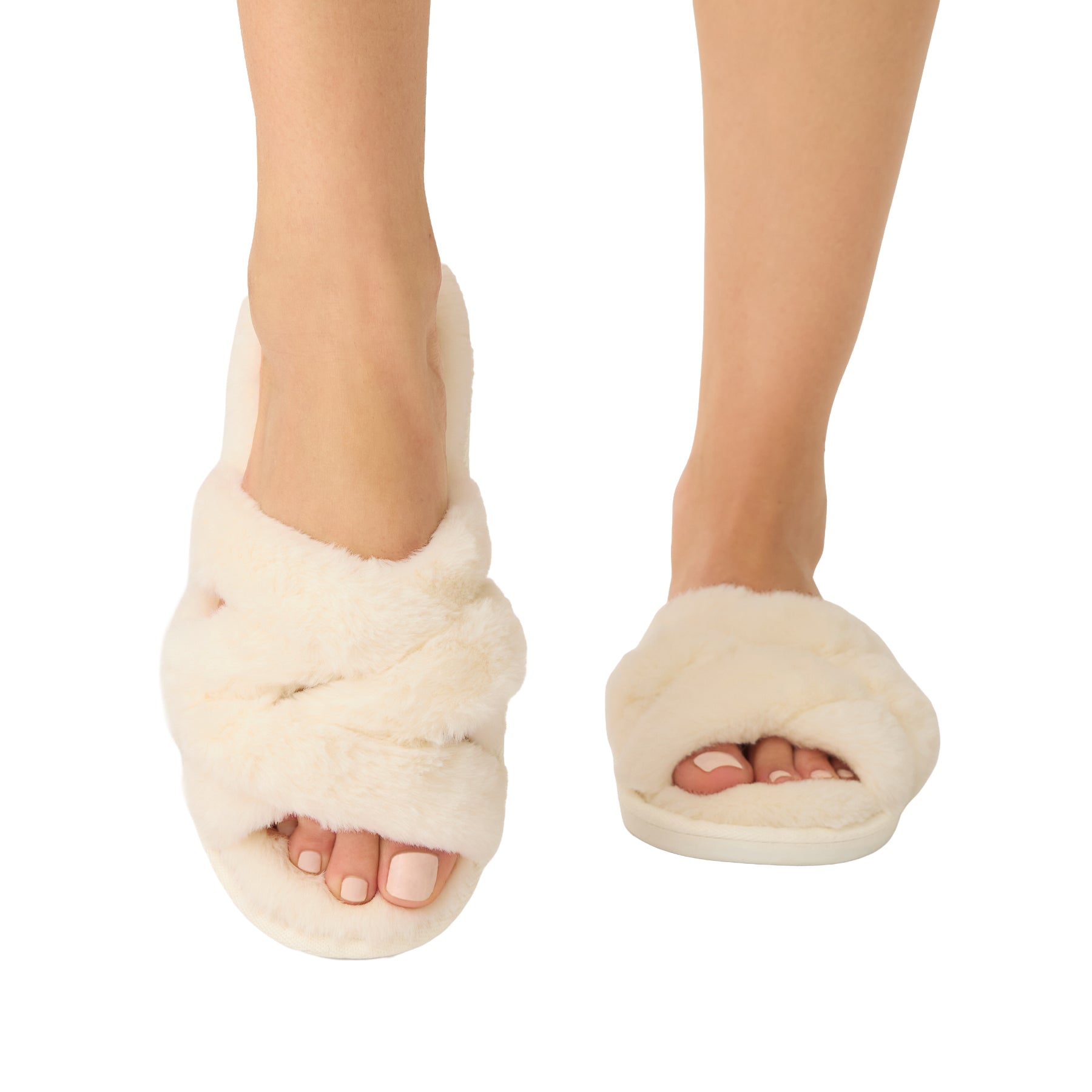 Front view of ivory fuzzy slippers featuring wide crisscross straps and an open-toe design.