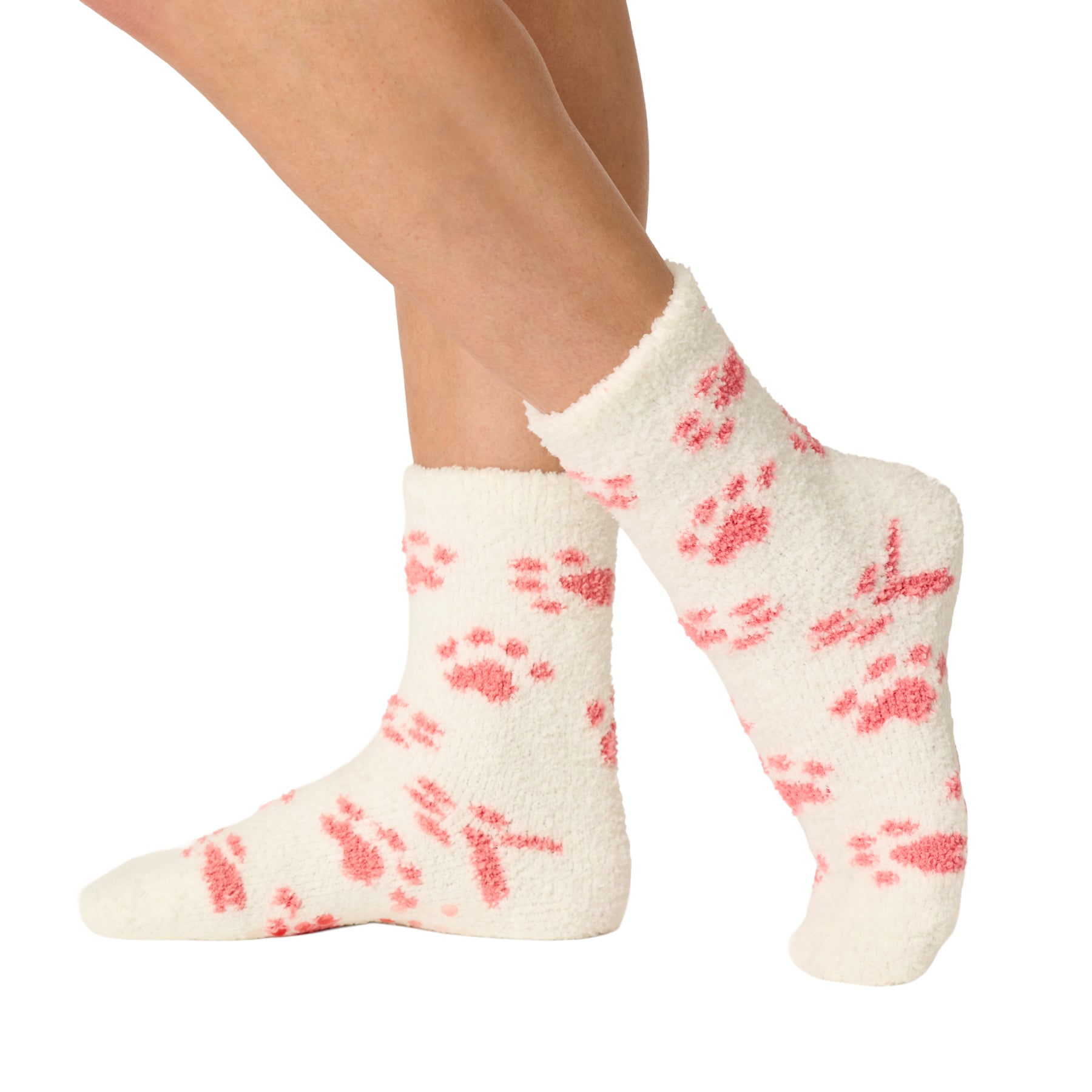 Side view of ivory plush socks with pink paw prints and a soft, fluffy texture.