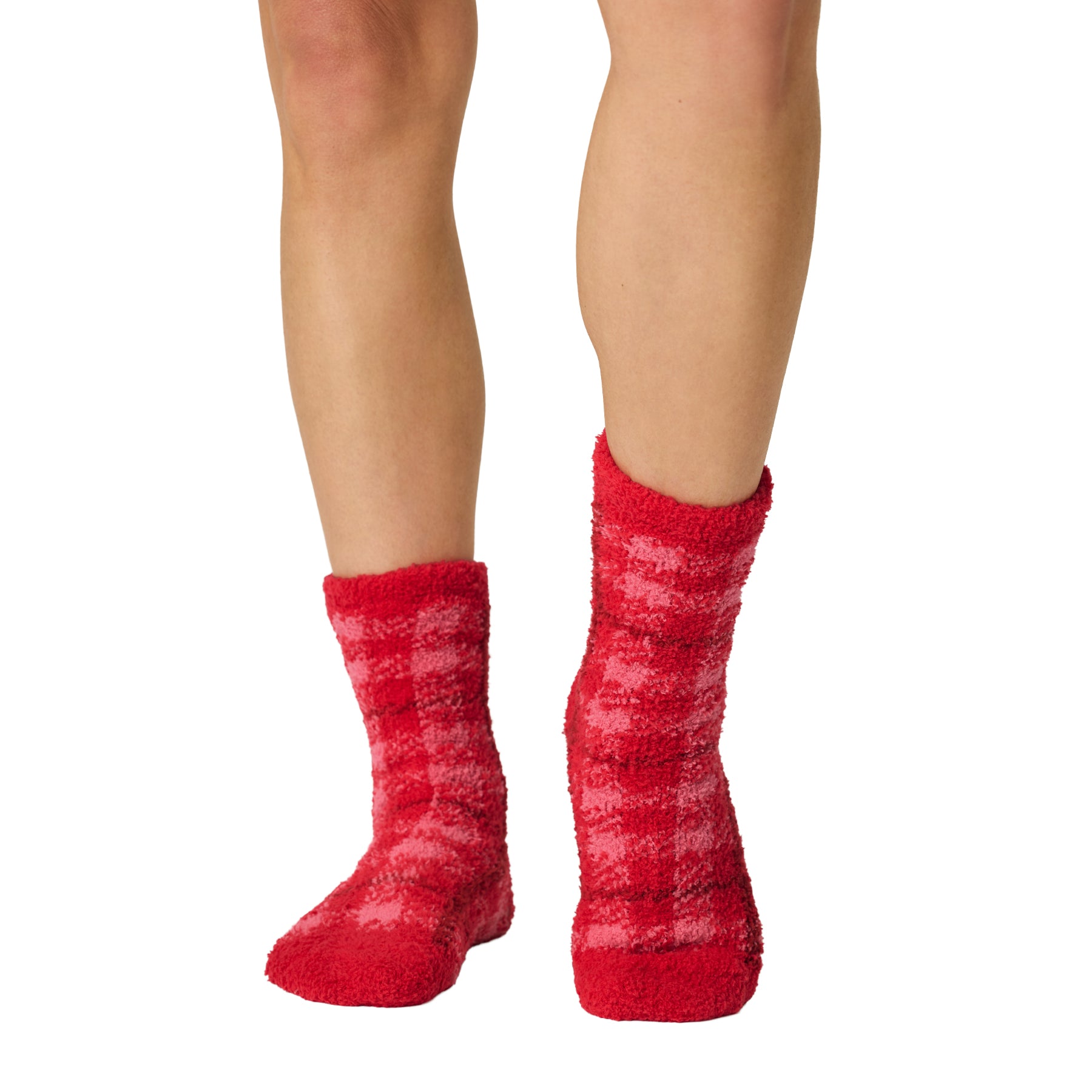 Front view of red fuzzy crew socks featuring a soft pink plaid pattern and plush texture.