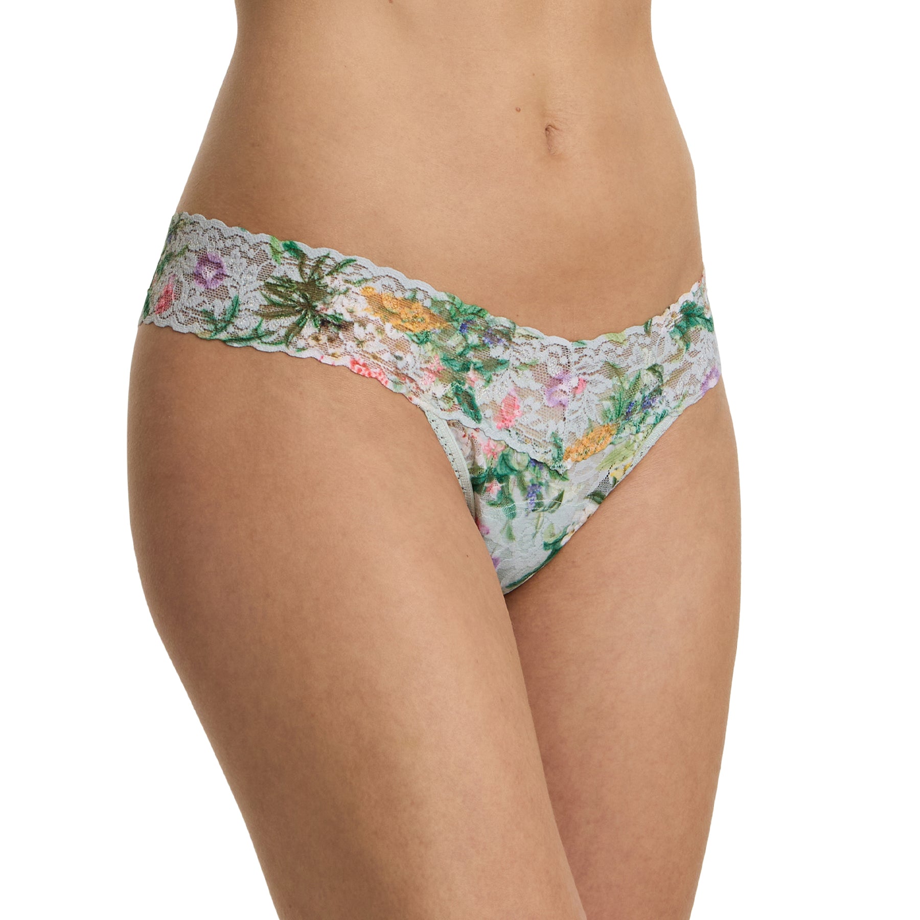 Angled front view of the floral lace thong highlighting the smooth leg openings and stretch lace fit.