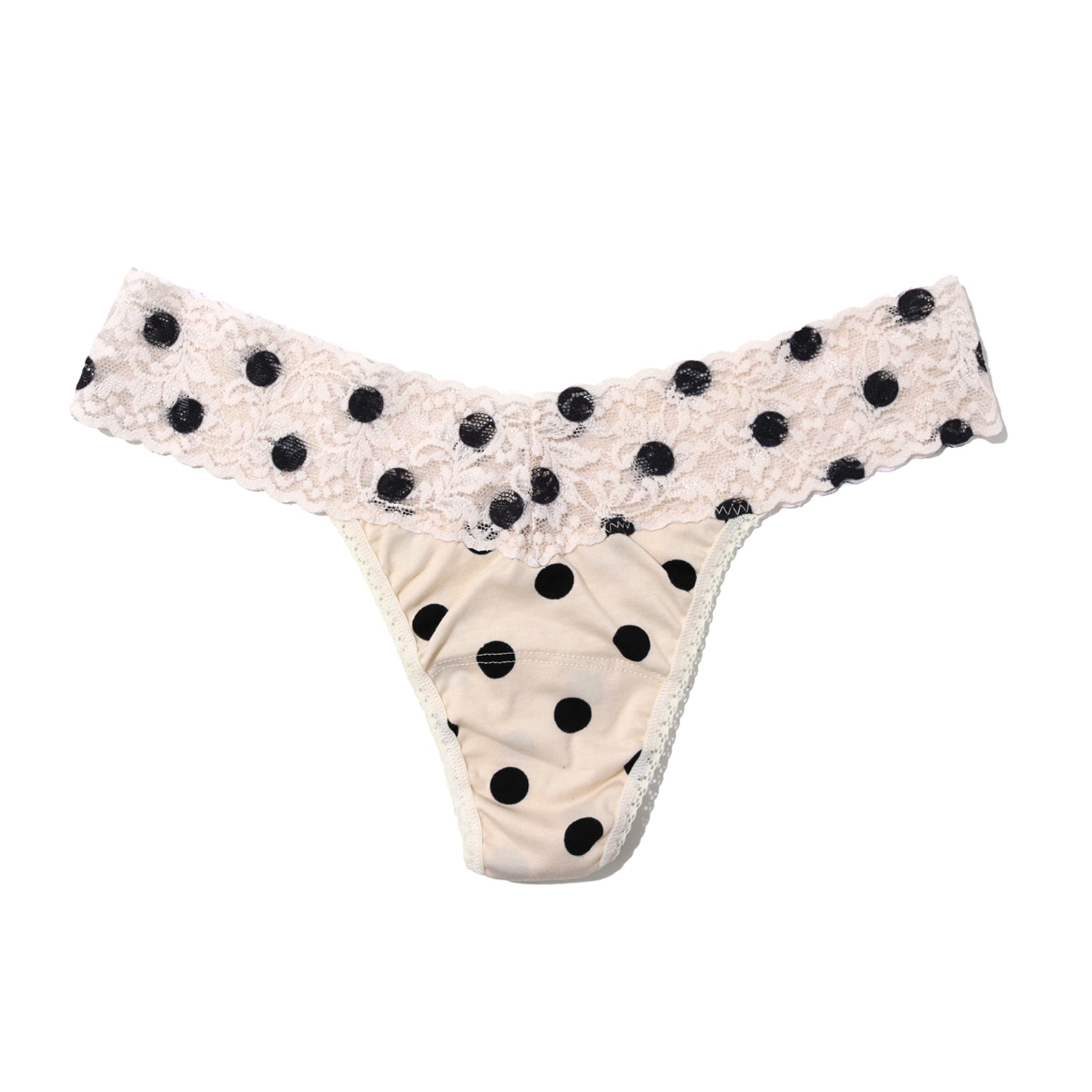 Cream thong with black polka dots, featuring a wide floral lace waistband and soft stretch fabric for a low-rise, seamless fit
